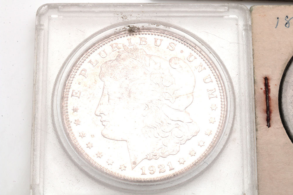Group of Five Silver Morgan Dollars Including the Following: 1884, 1886, and three 1921