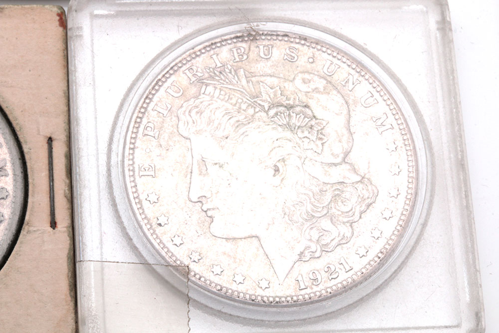 Group of Five Silver Morgan Dollars Including the Following: 1884, 1886, and three 1921