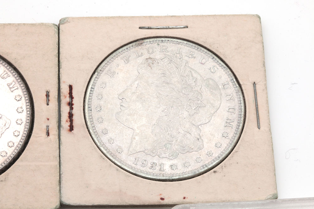 Group of Five Silver Morgan Dollars Including the Following: 1884, 1886, and three 1921