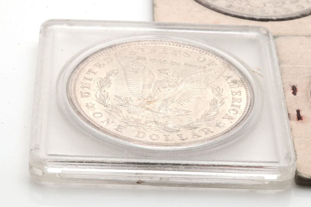 Group of Five Silver Morgan Dollars Including the Following: 1884, 1886, and three 1921