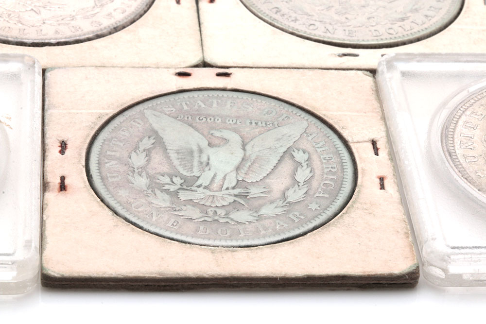 Group of Five Silver Morgan Dollars Including the Following: 1884, 1886, and three 1921