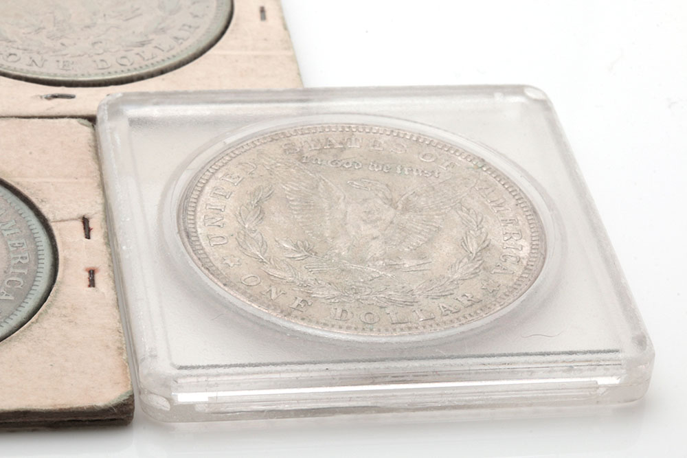 Group of Five Silver Morgan Dollars Including the Following: 1884, 1886, and three 1921