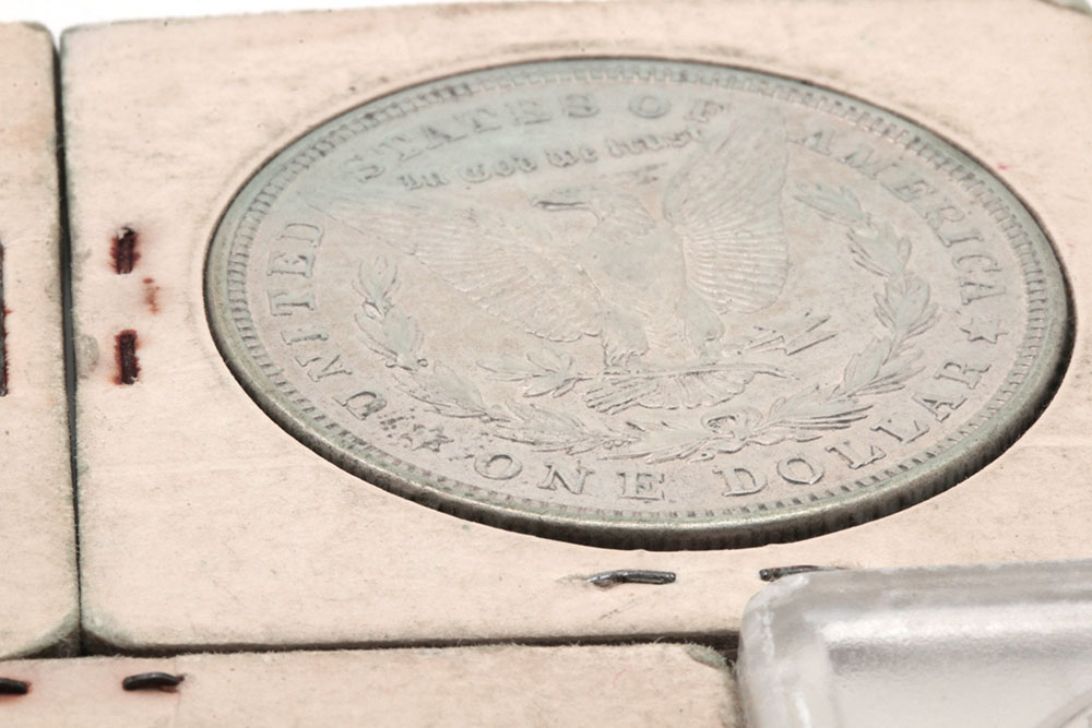 Group of Five Silver Morgan Dollars Including the Following: 1884, 1886, and three 1921