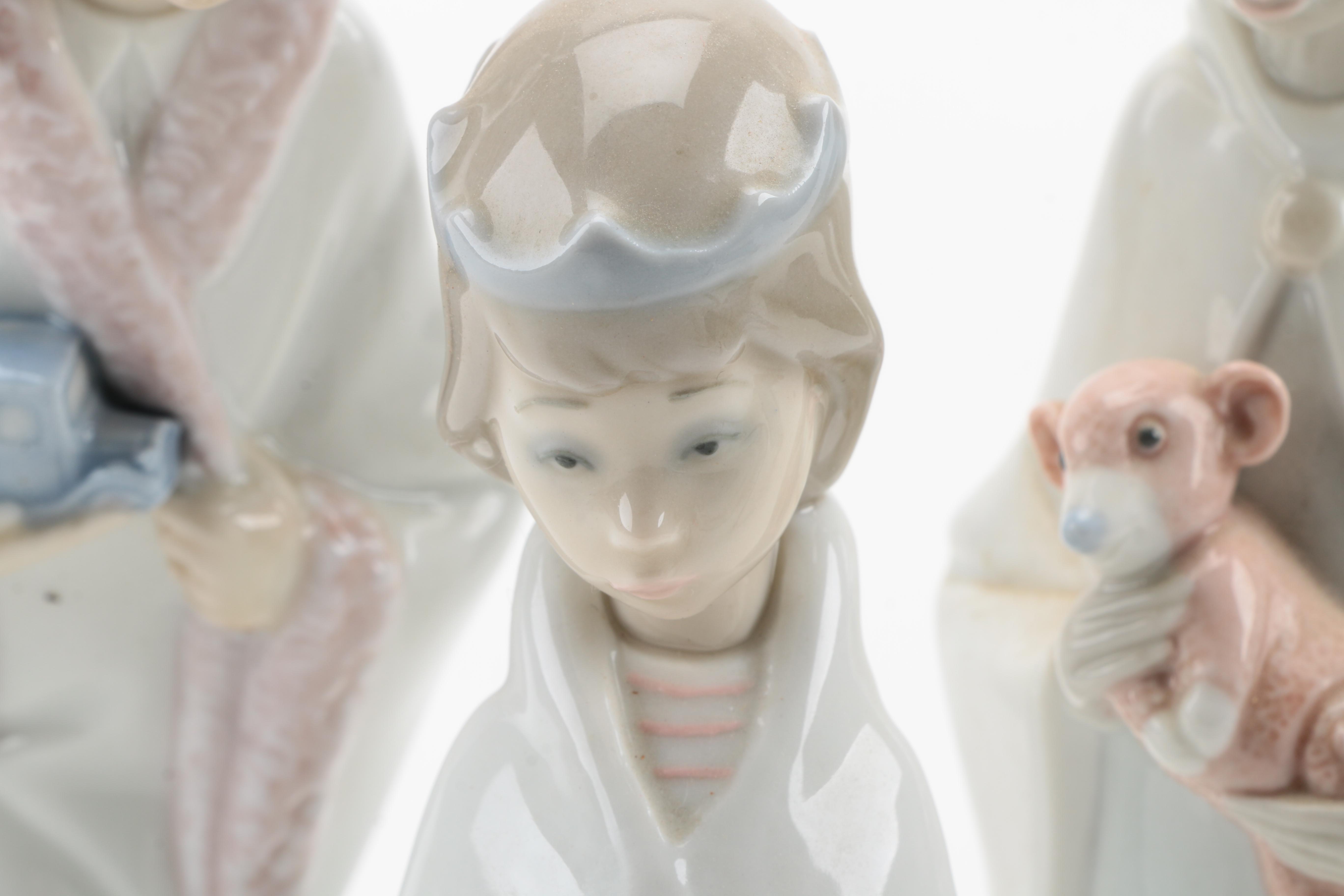 Lladró Ten Piece Nativity Porcelain Figurine Set and Wooden Crèche