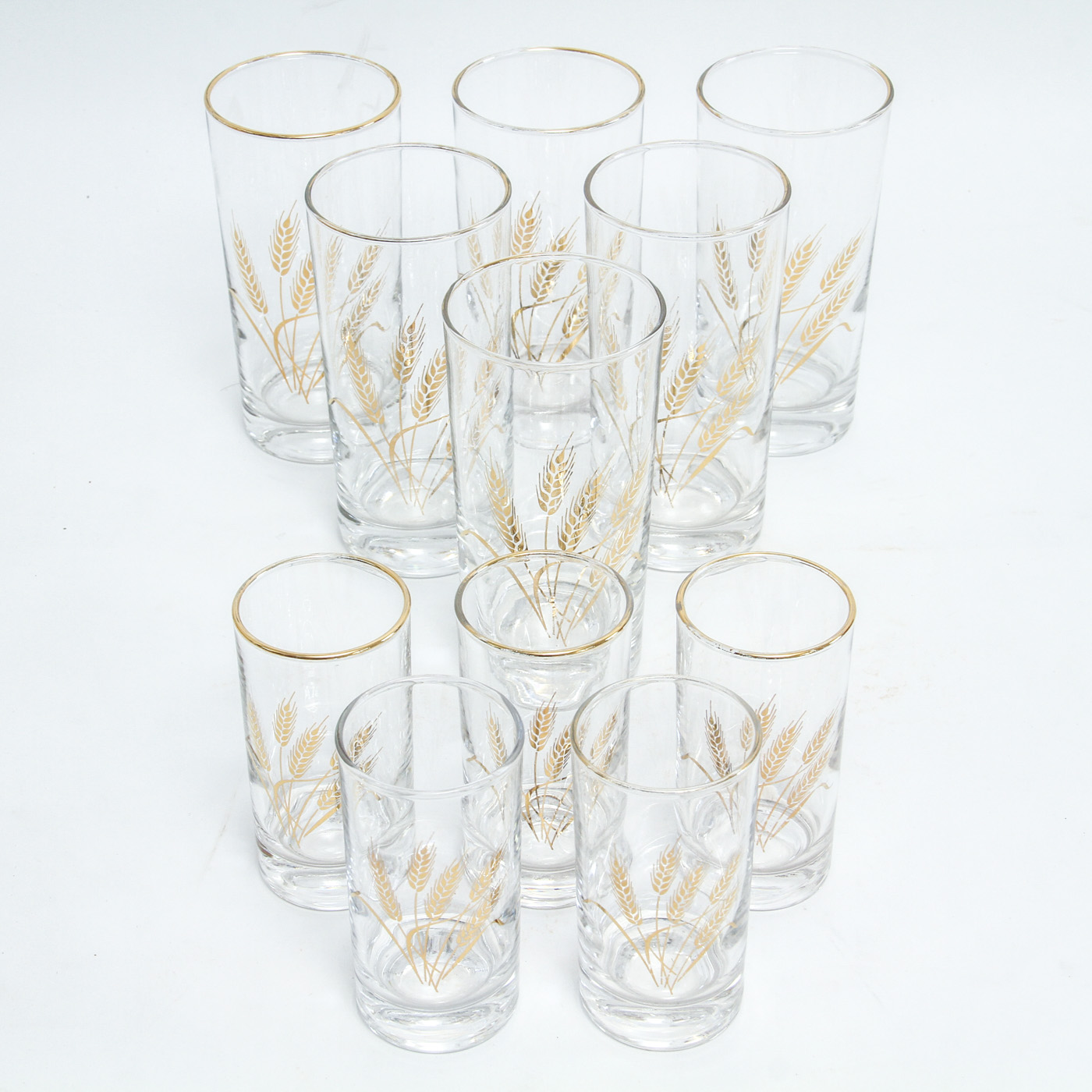 Collection of Eleven Mid-Century Drinking Glasses with a Gold Tone Wheat Motif