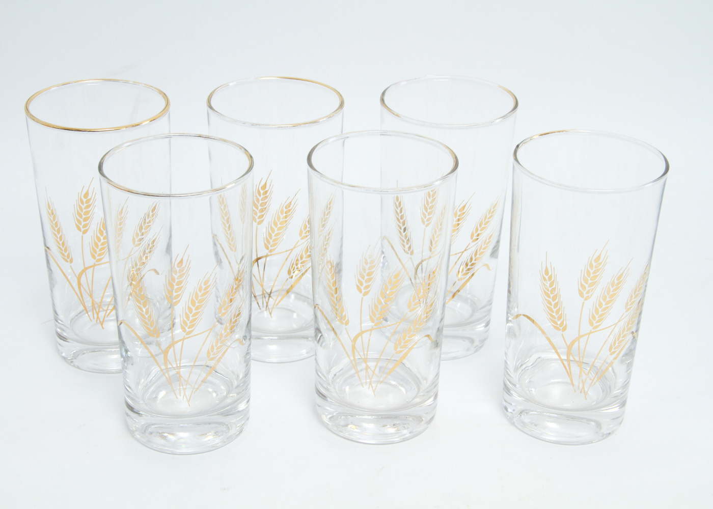 Collection of Eleven Mid-Century Drinking Glasses with a Gold Tone Wheat Motif