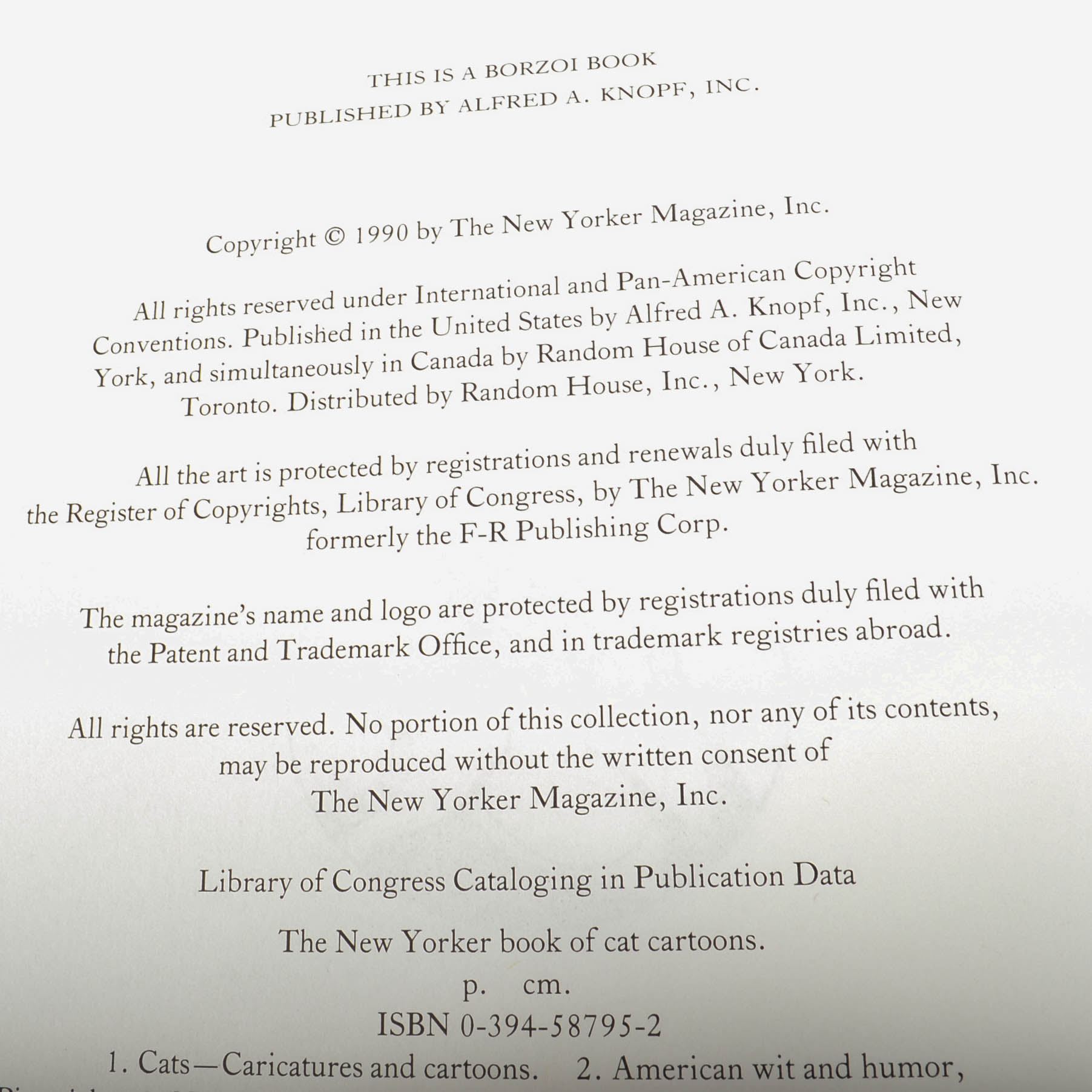 Carved Cat and Mouse Sculptures and Cat-Themed Books