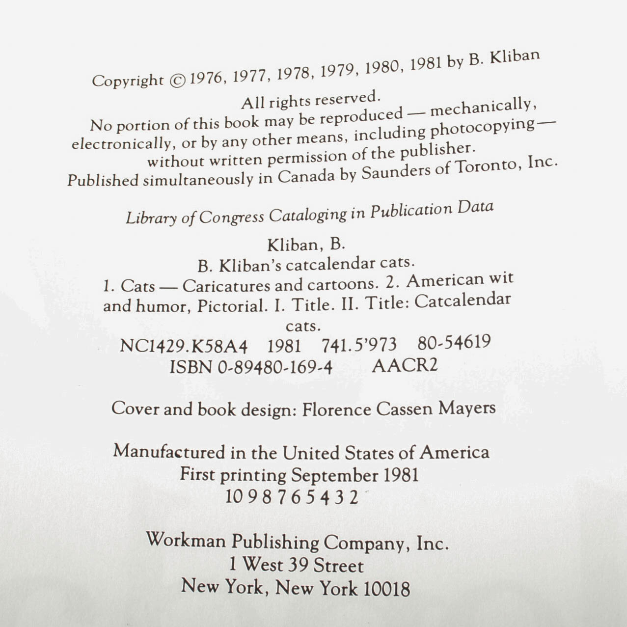 Carved Cat and Mouse Sculptures and Cat-Themed Books