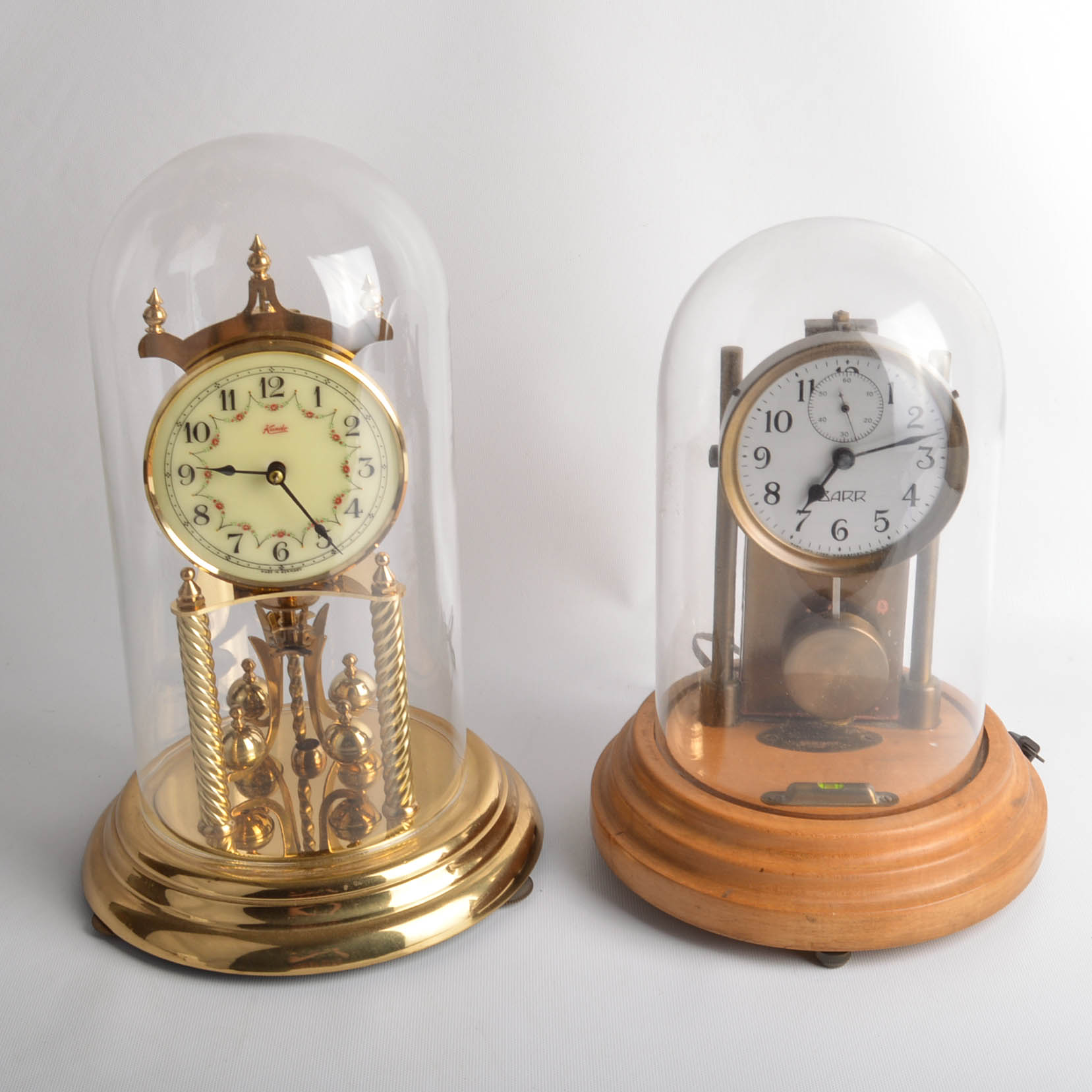 Two Glass Domed Clocks