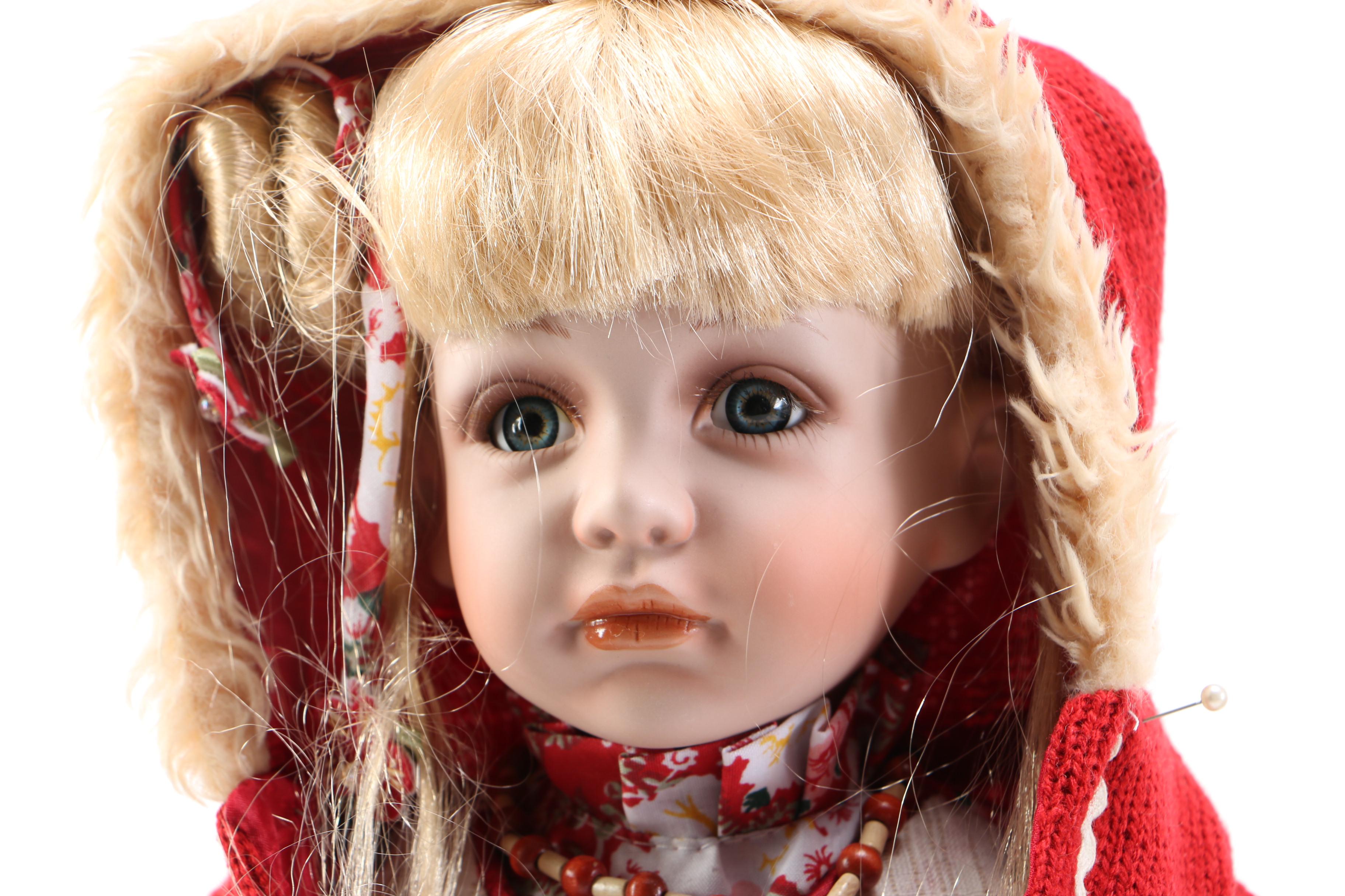 Pair of Porcelain Dolls in Seasonal Outfits