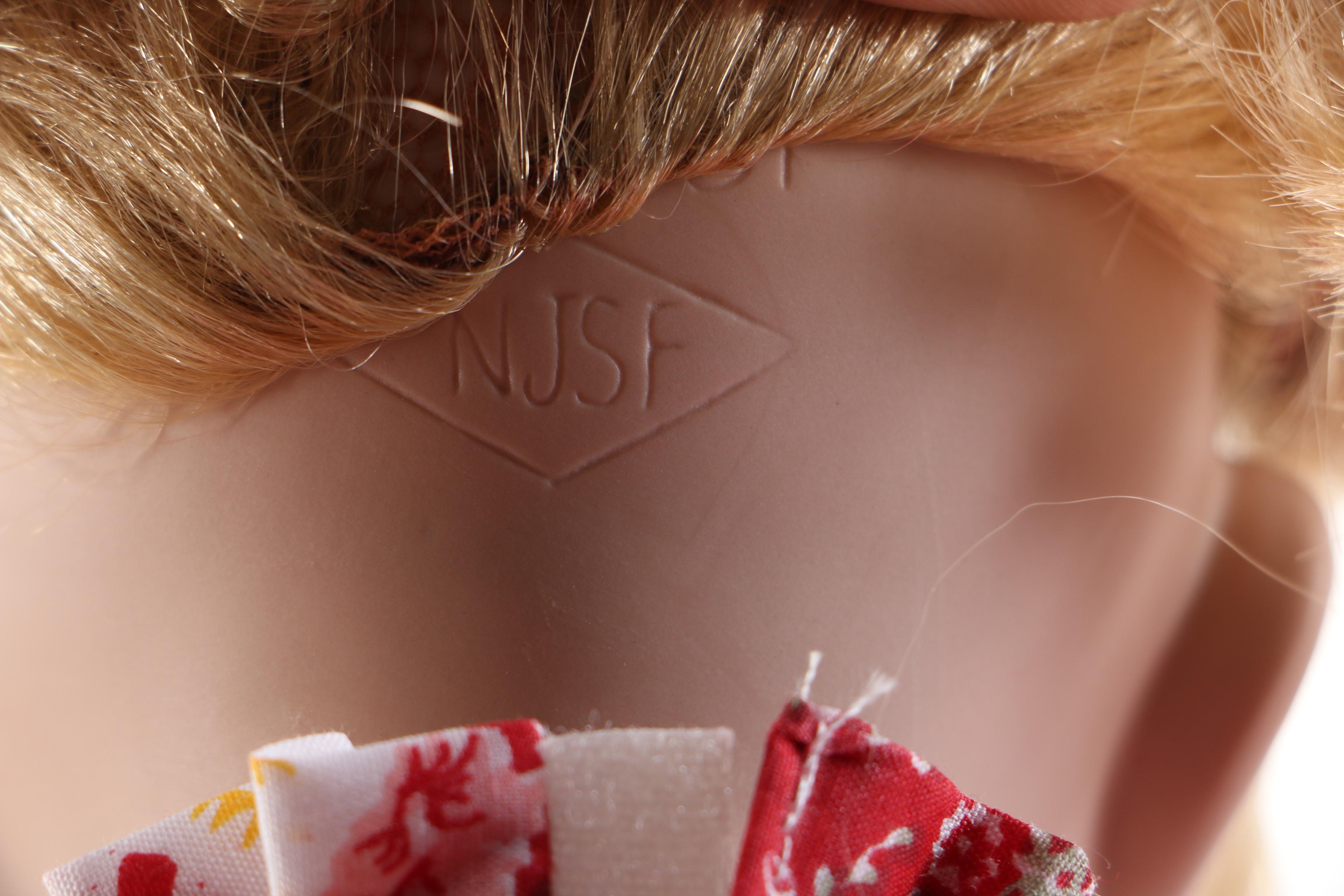 Pair of Porcelain Dolls in Seasonal Outfits