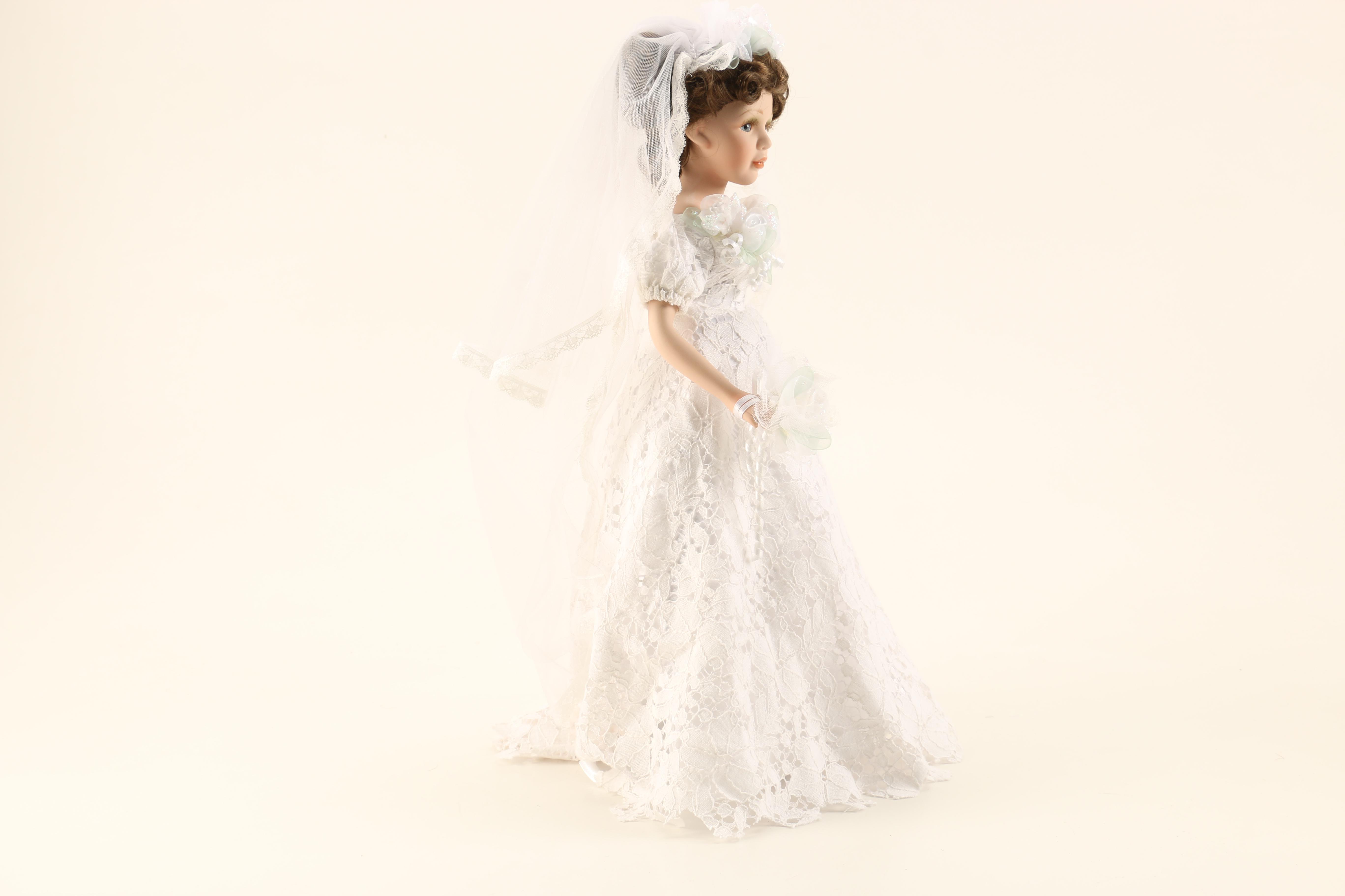 Collection of Three Porcelain Dolls