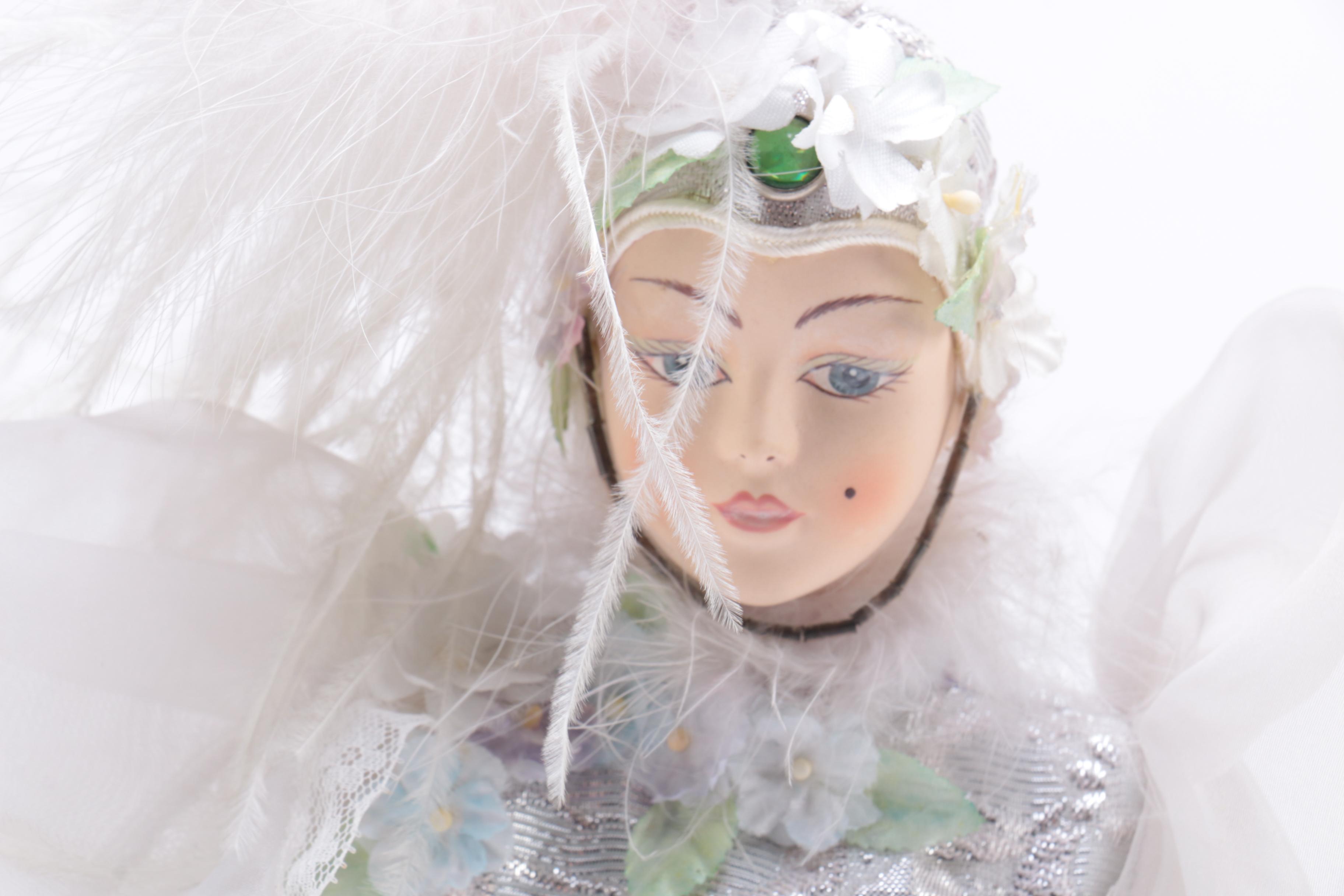 Porcelain Doll in a White Dress