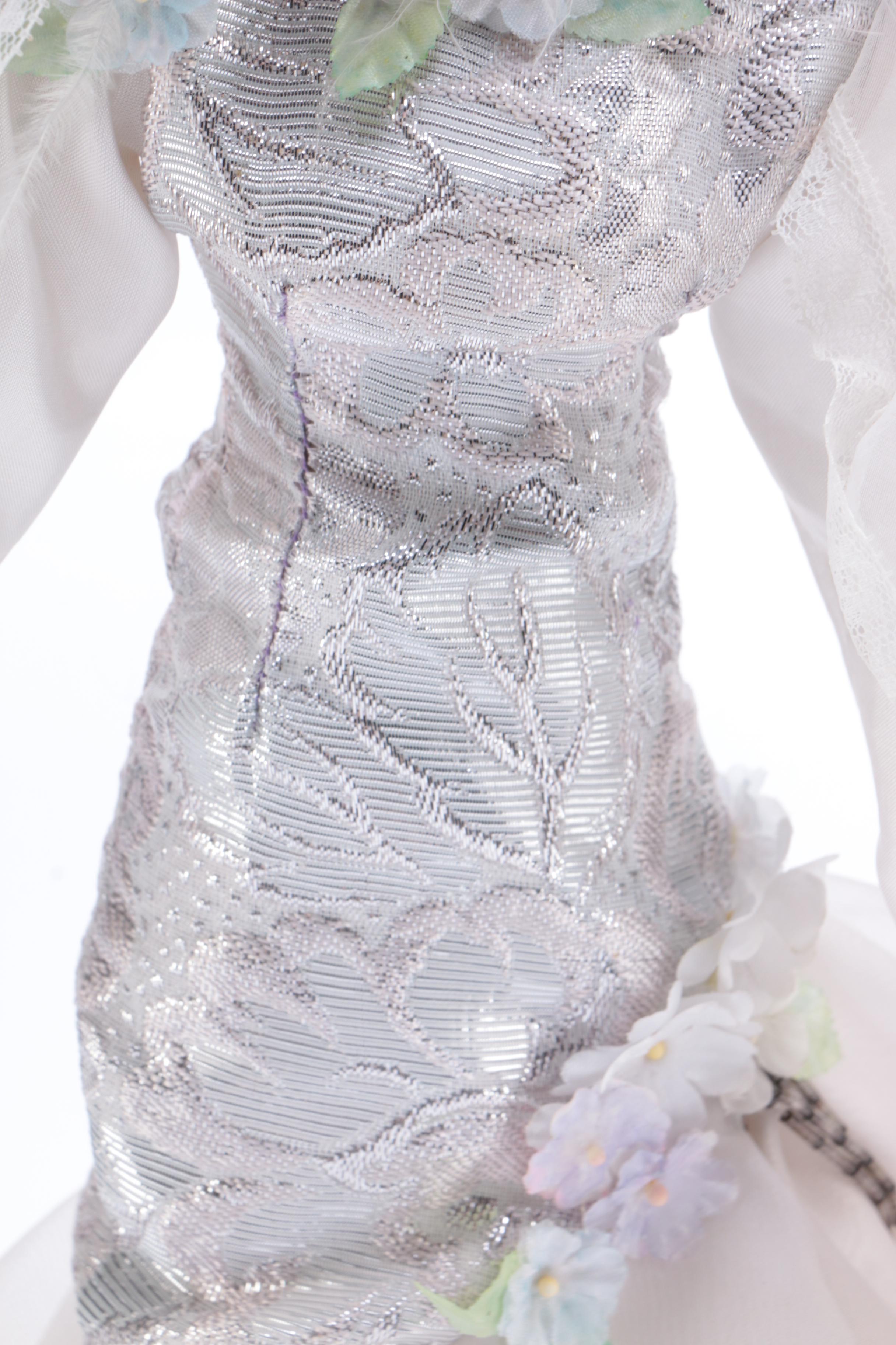 Porcelain Doll in a White Dress