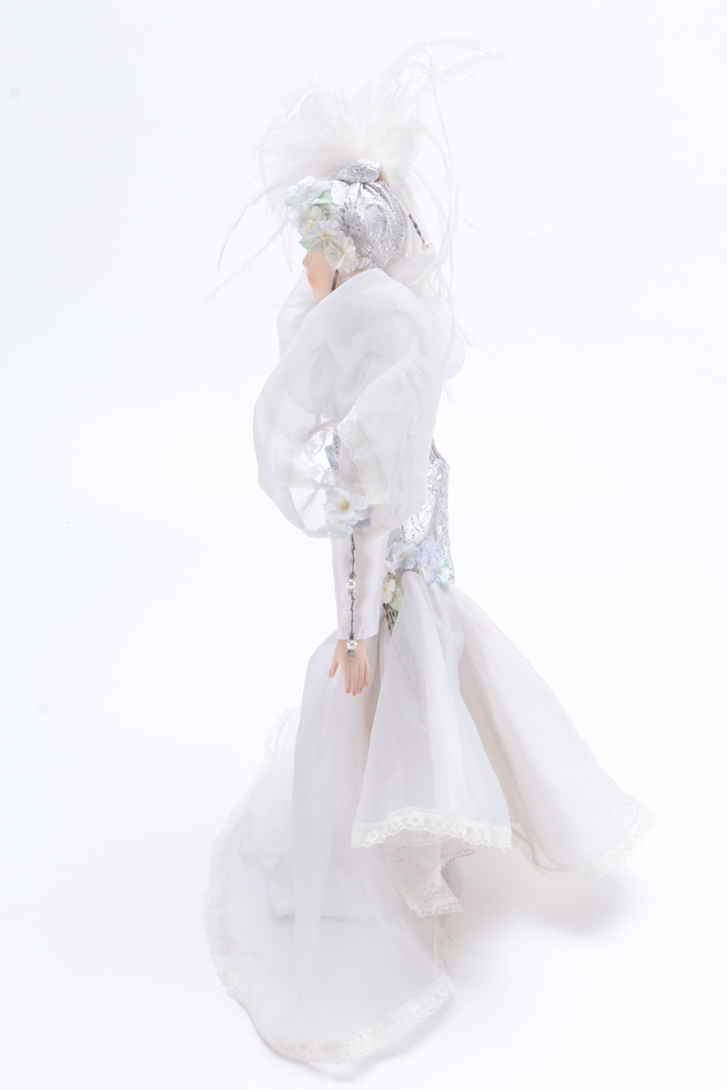 Porcelain Doll in a White Dress