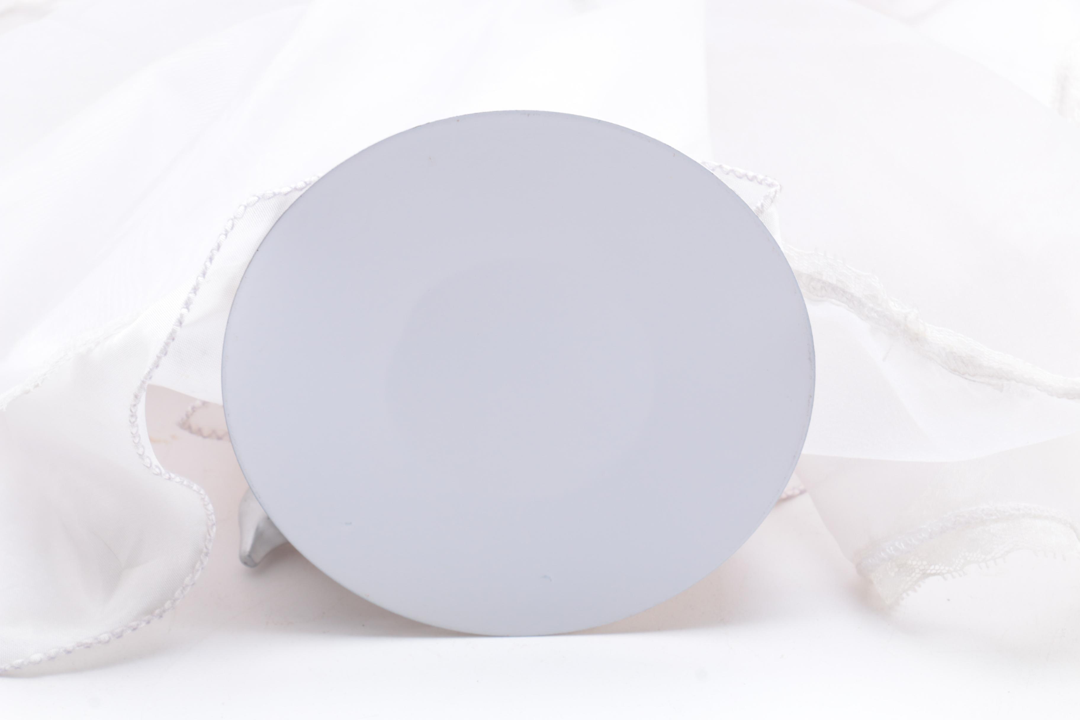 Porcelain Doll in a White Dress