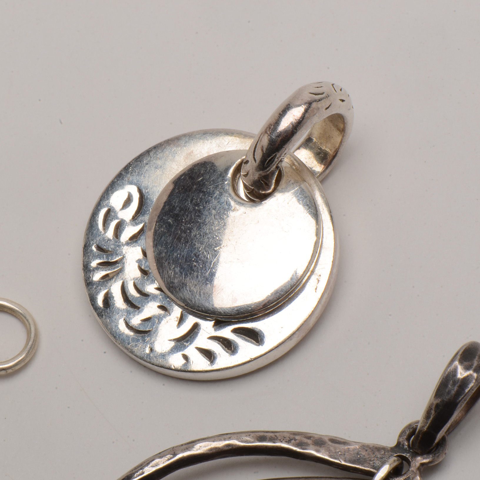 Grouping of Three Sterling Silver Pendants