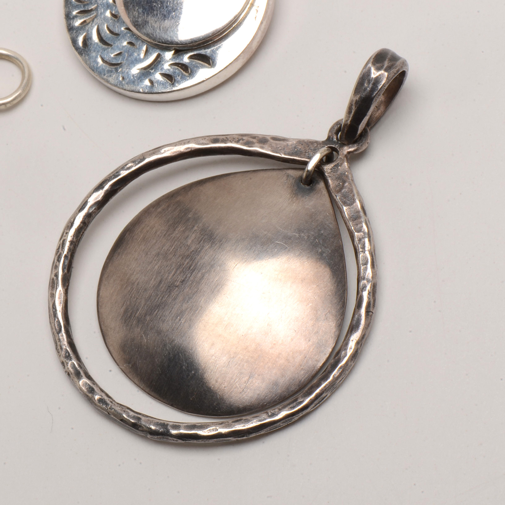 Grouping of Three Sterling Silver Pendants