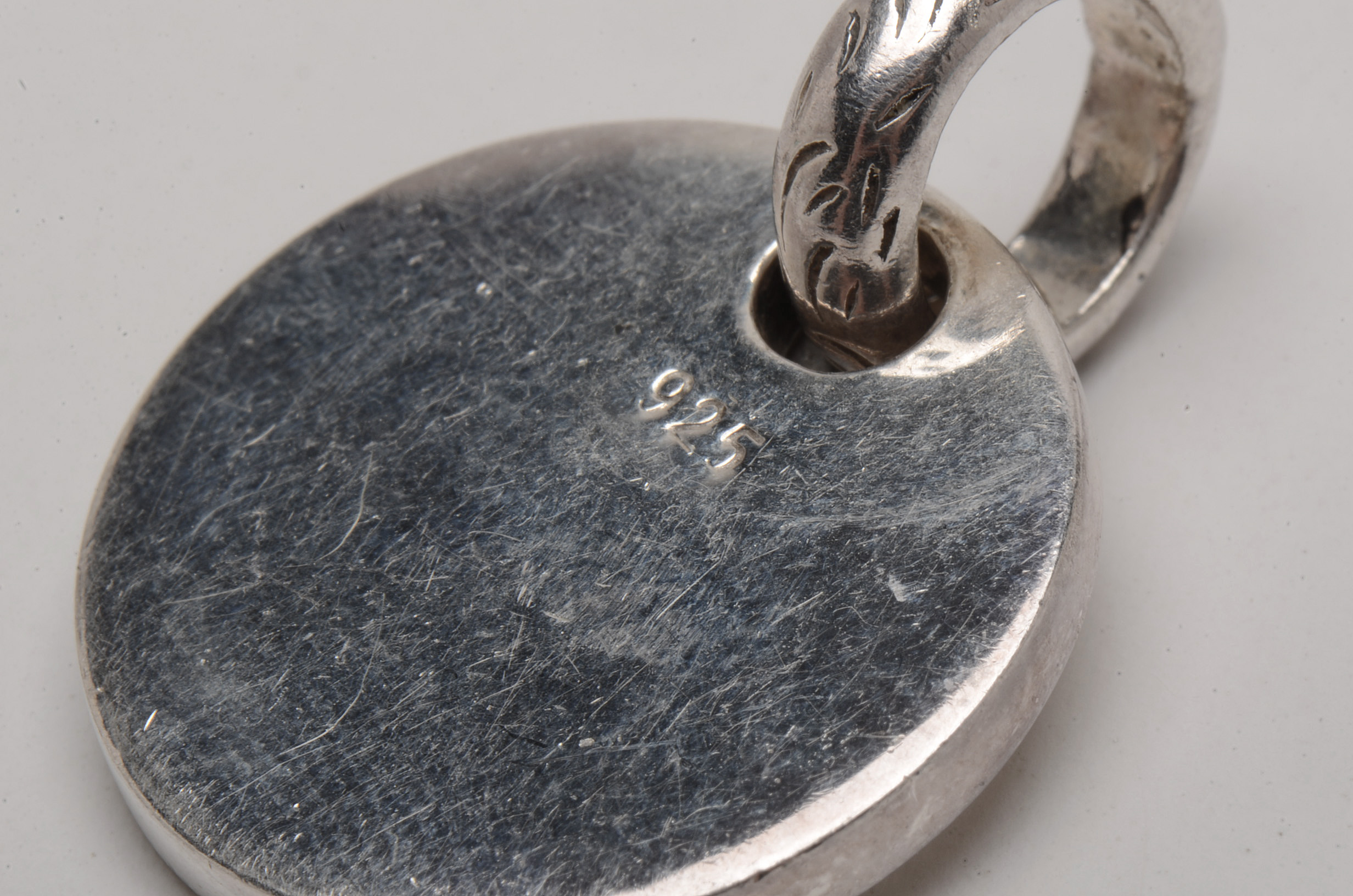 Grouping of Three Sterling Silver Pendants