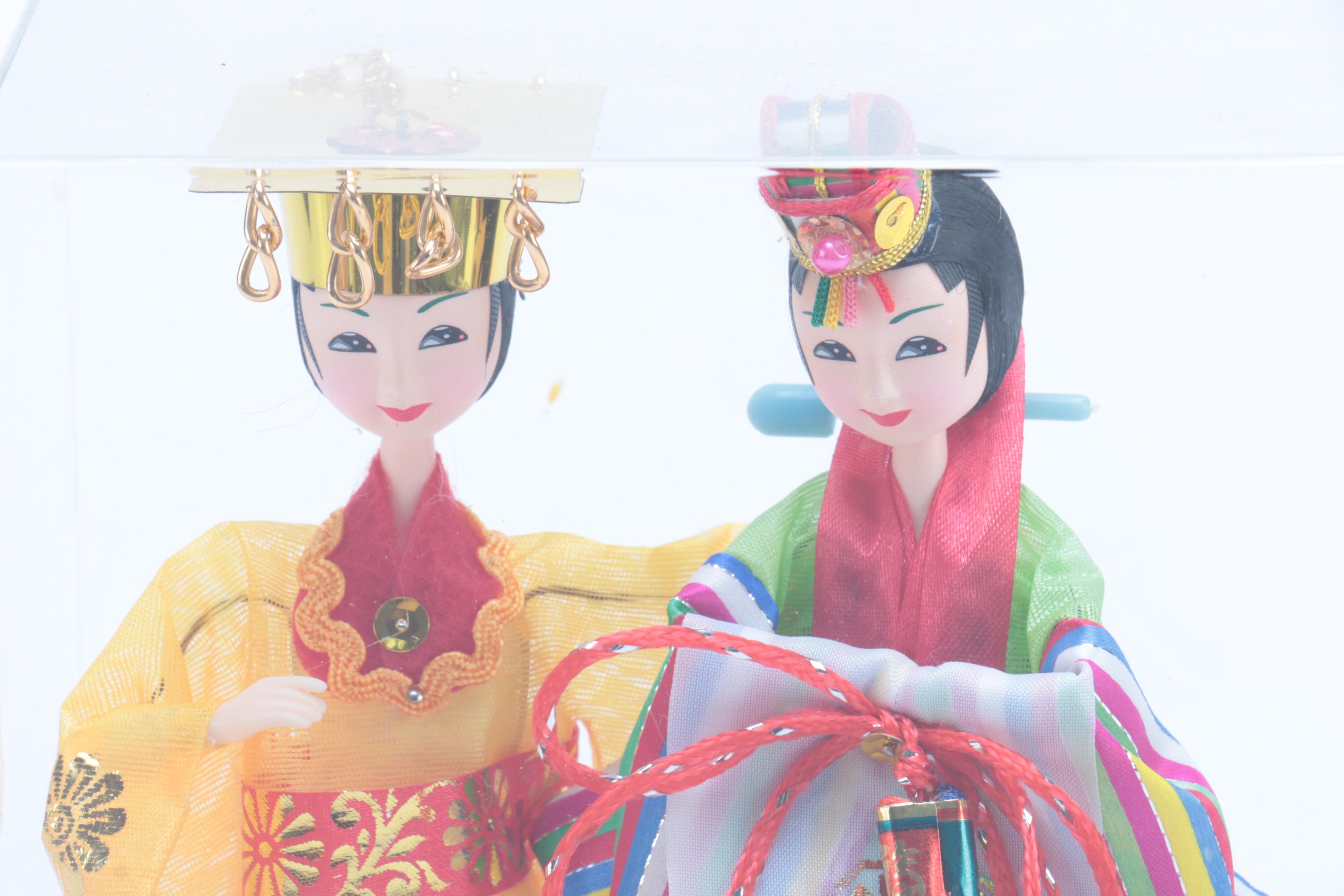 Collection of Four Asian Dolls
