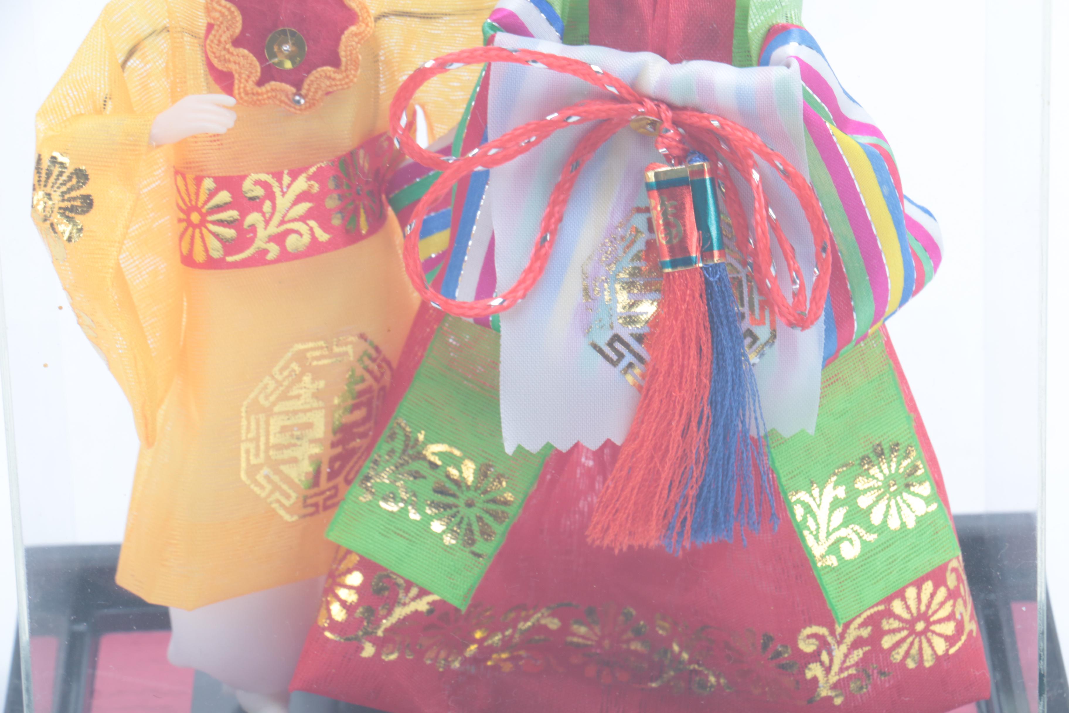 Collection of Four Asian Dolls