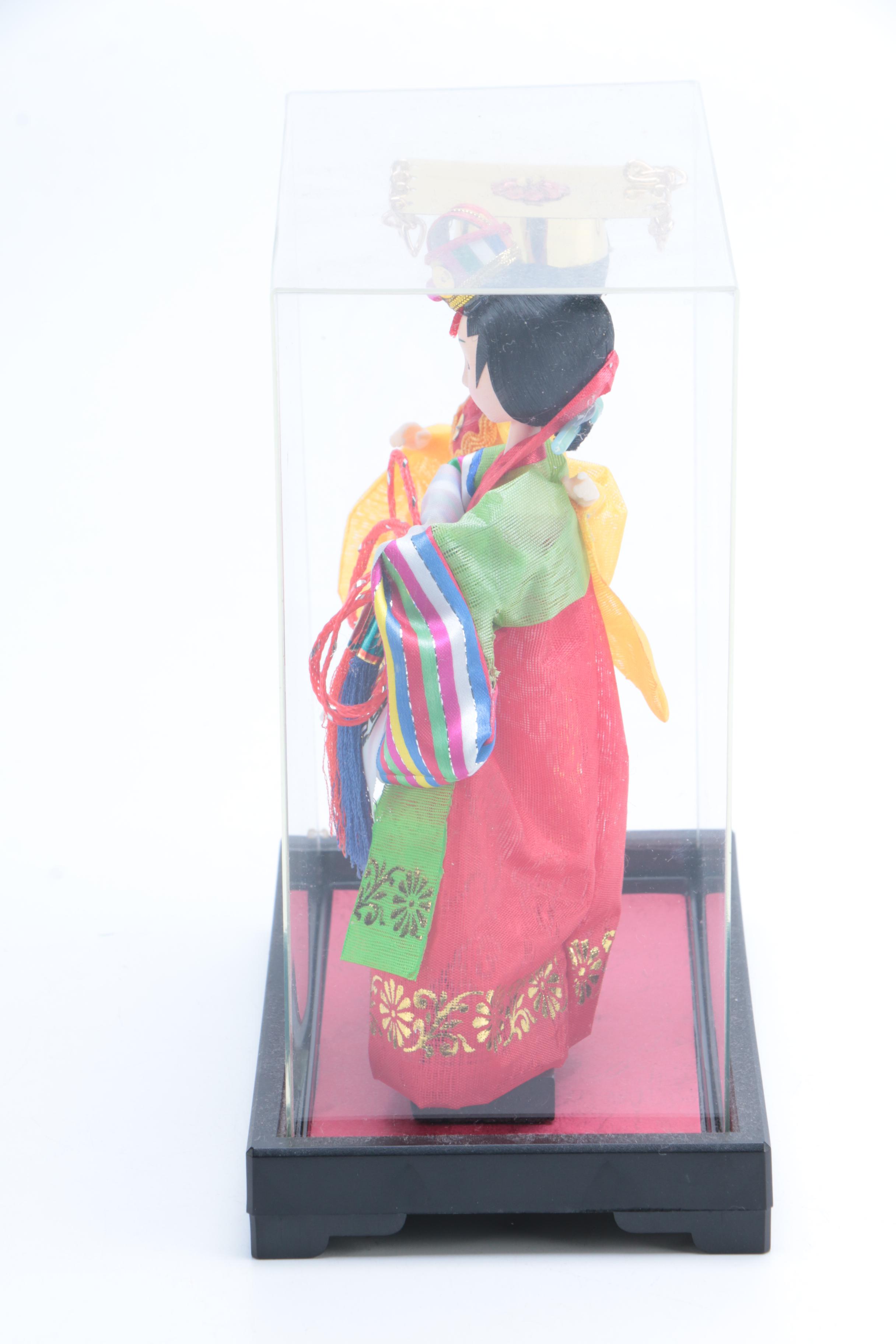 Collection of Four Asian Dolls