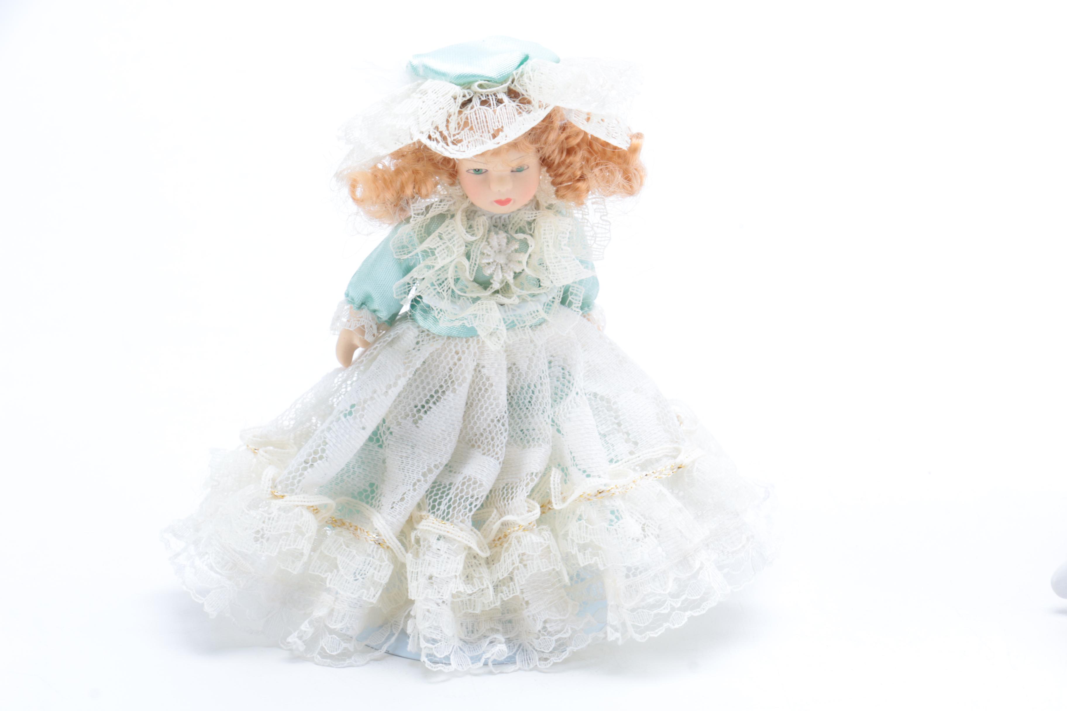 A Pair of Porcelain Dolls