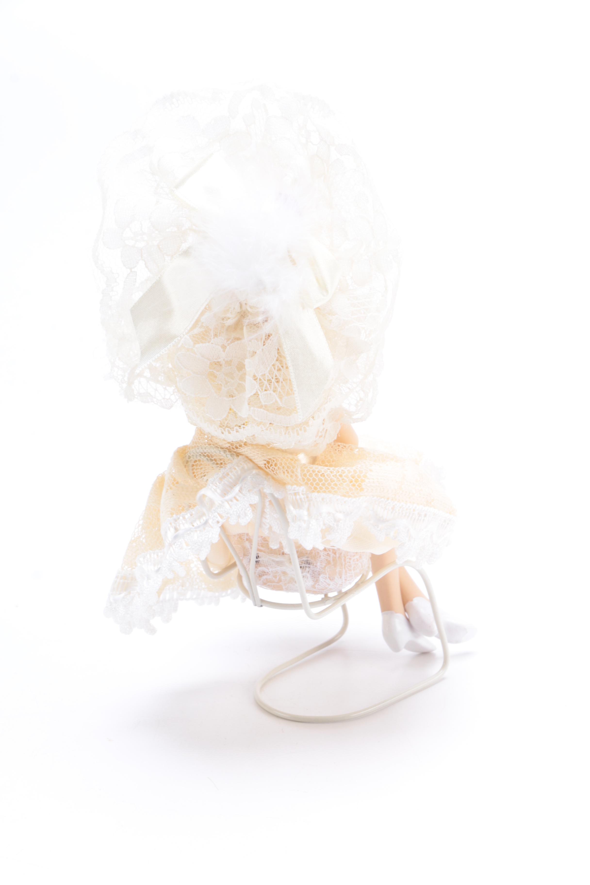 A Pair of Porcelain Dolls