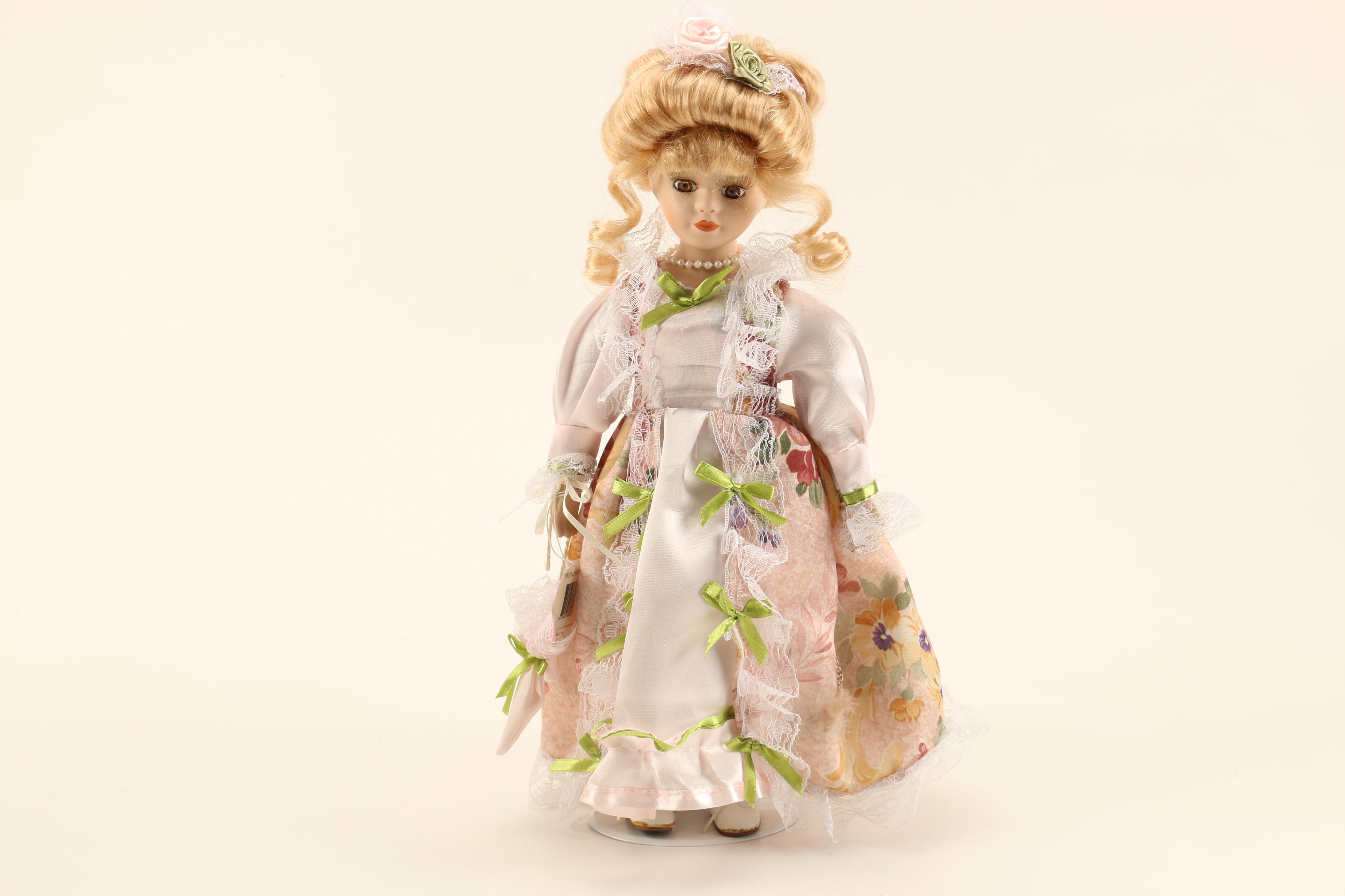 Collection of Four Porcelain Dolls