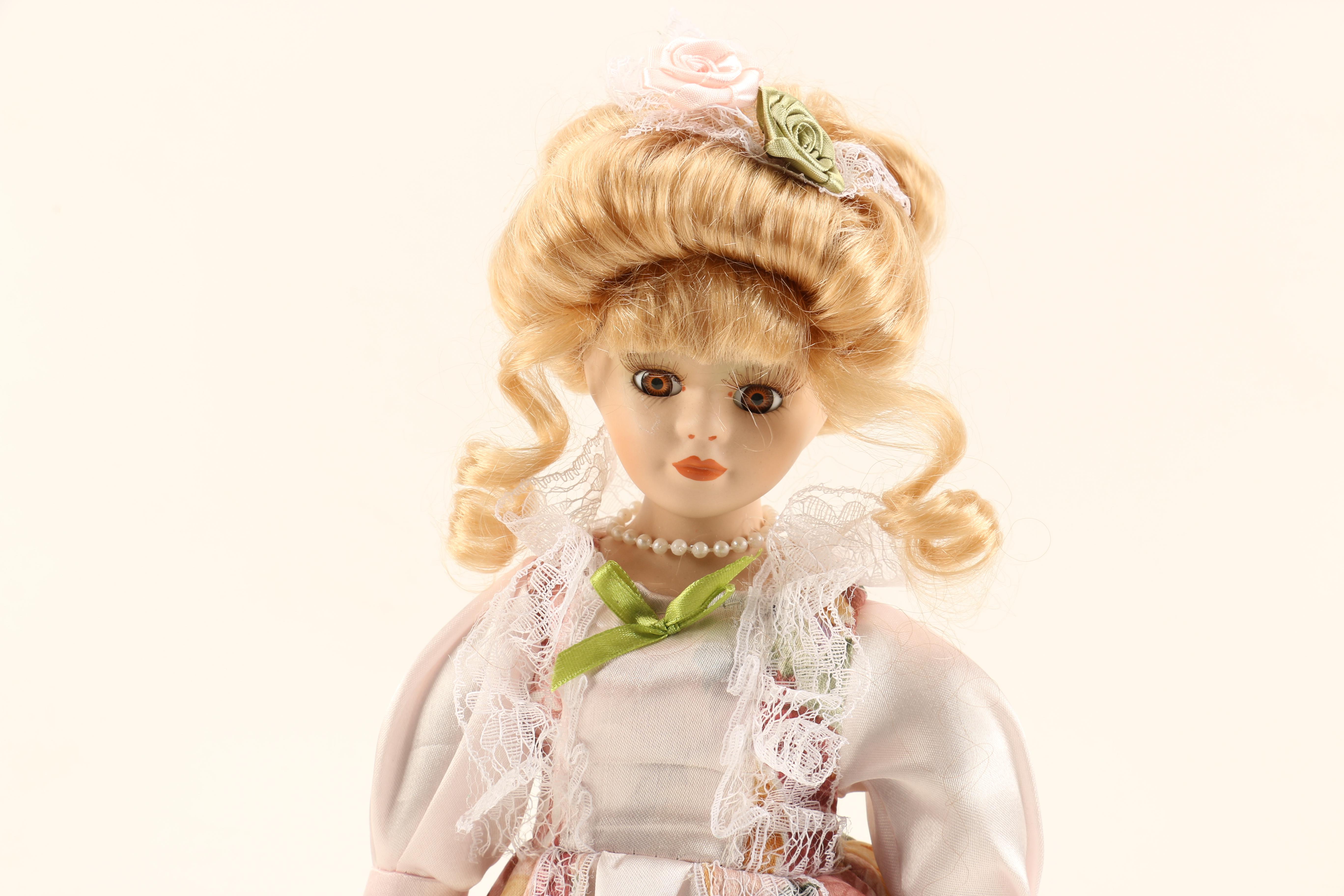 Collection of Four Porcelain Dolls