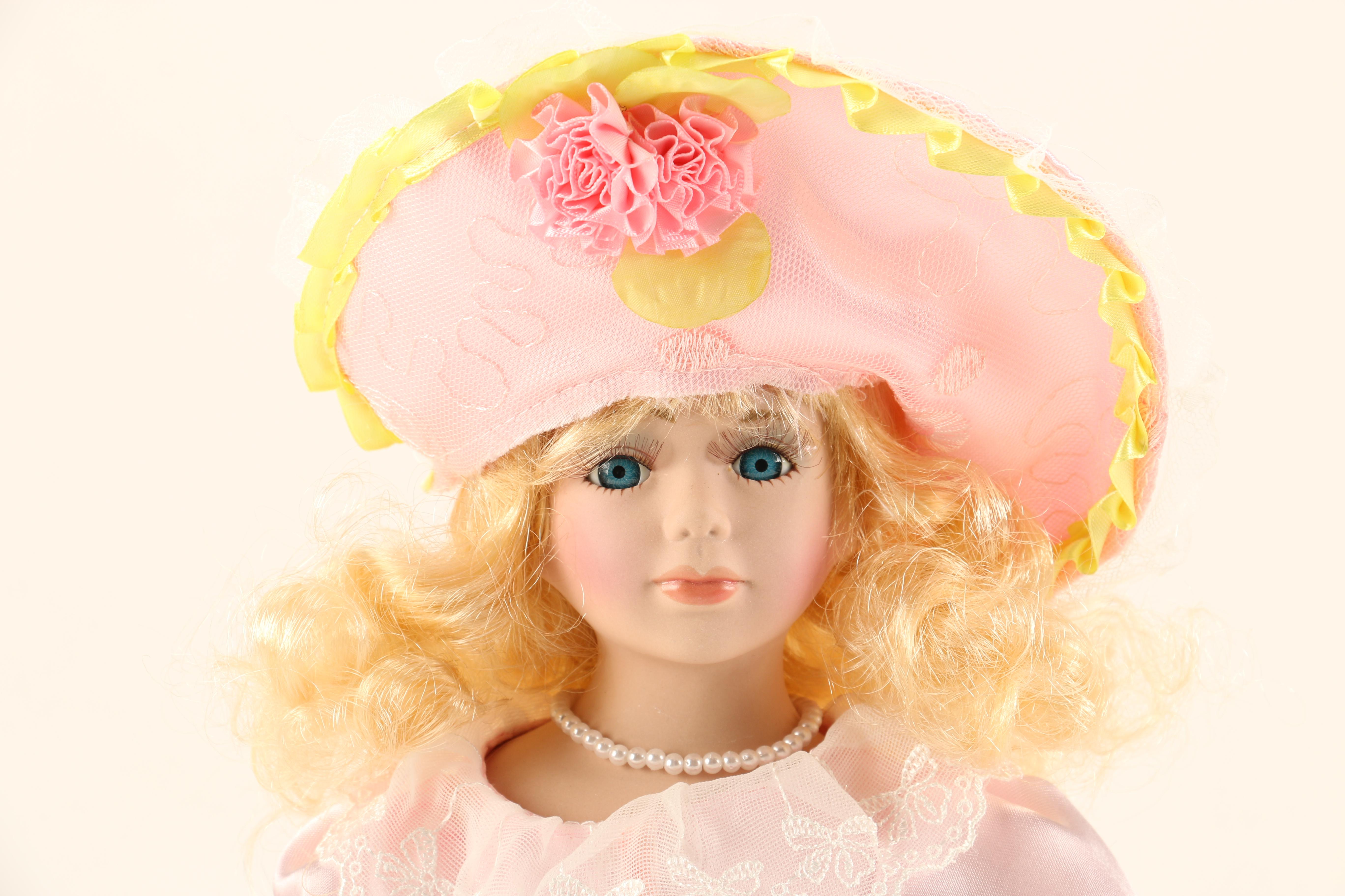 Collection of Four Porcelain Dolls