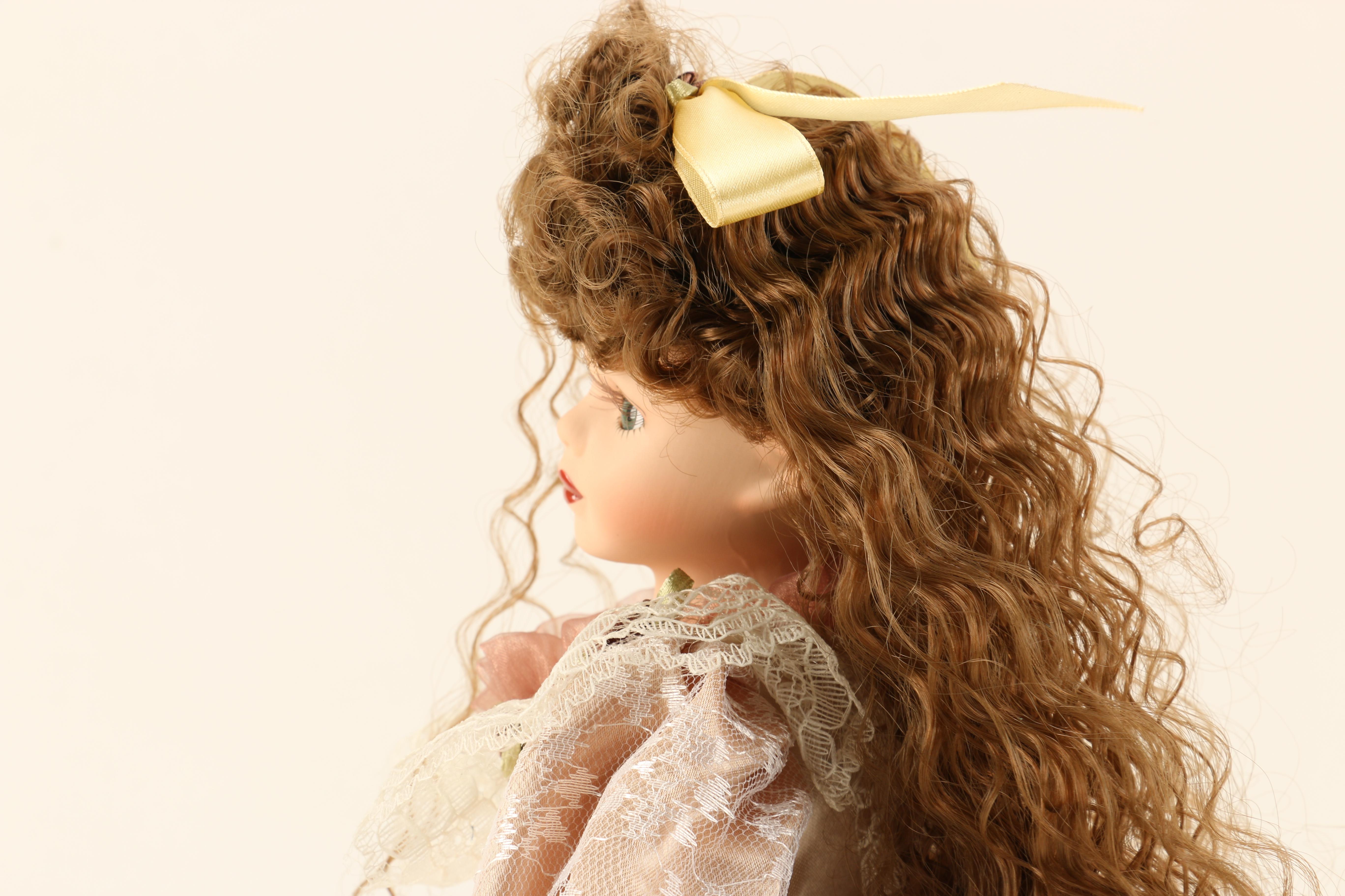 Collection of Four Porcelain Dolls