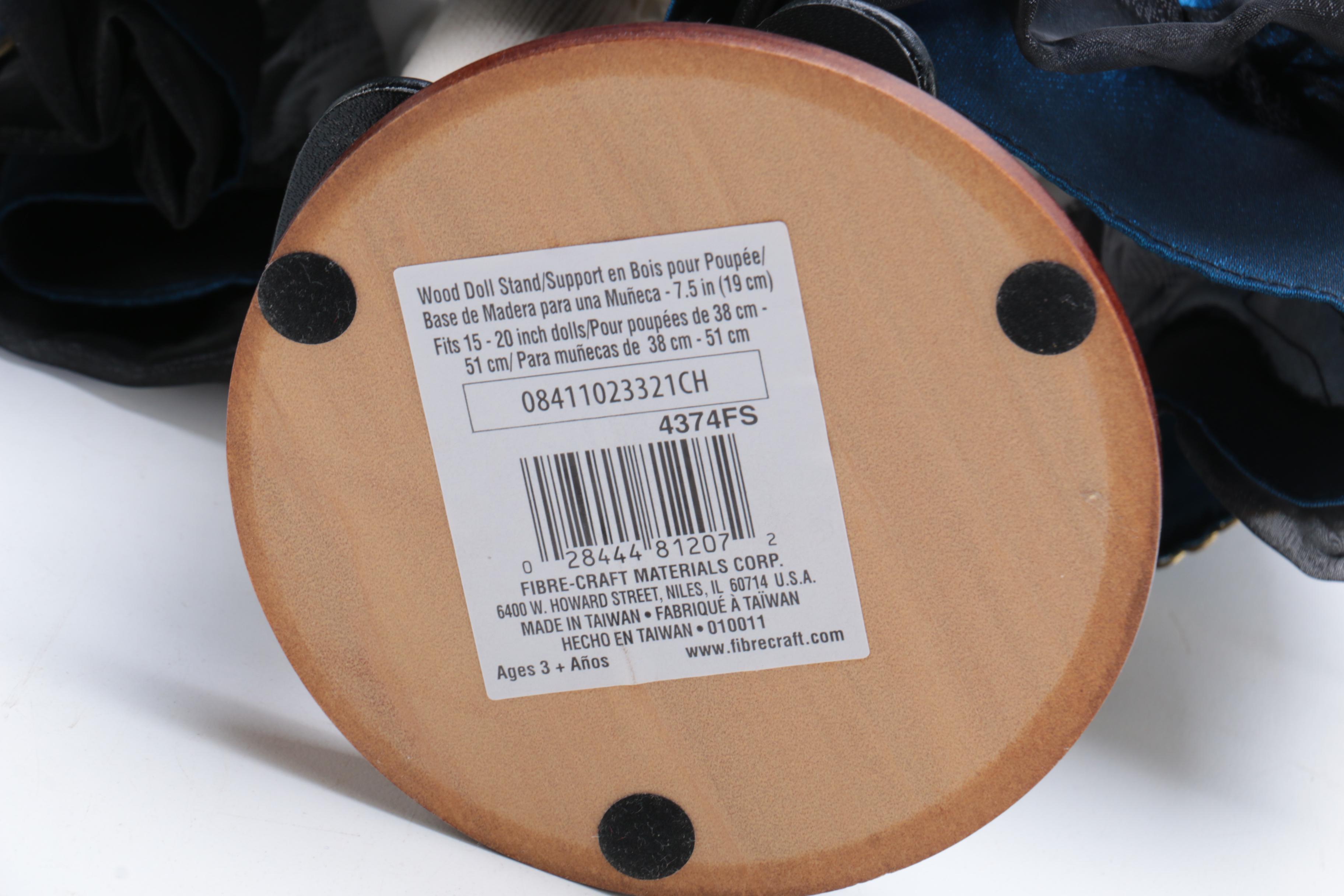 Porcelain Doll with Wooden Stand