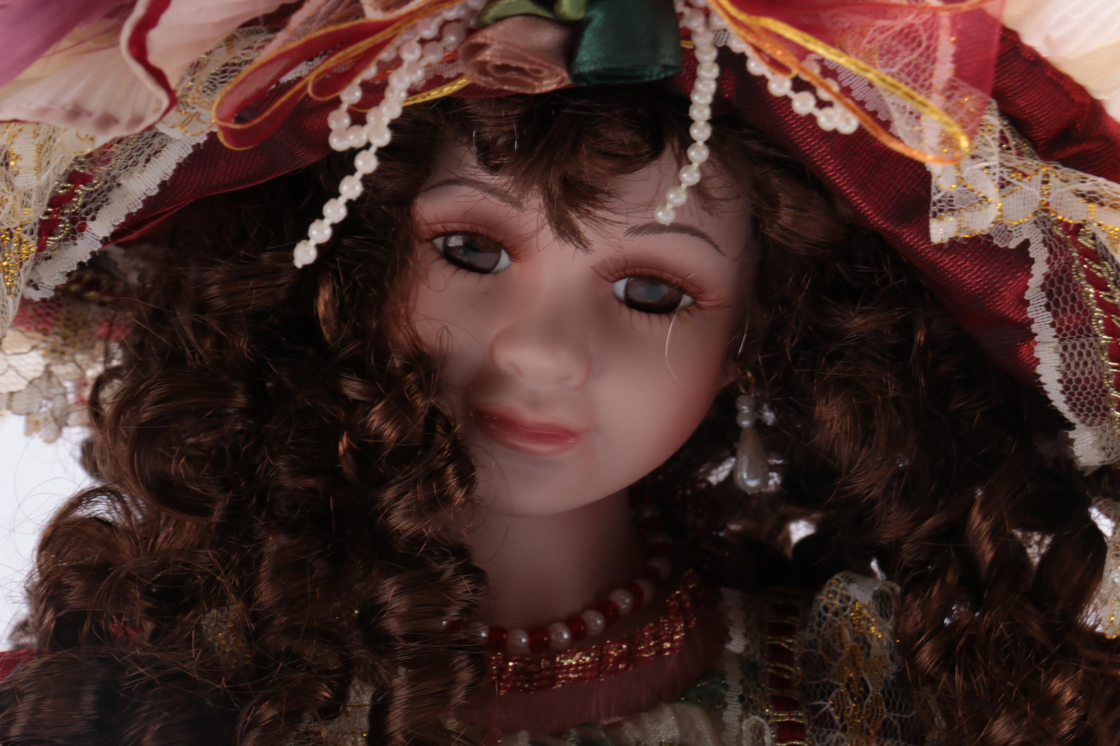 Collection of Four Porcelain Dolls