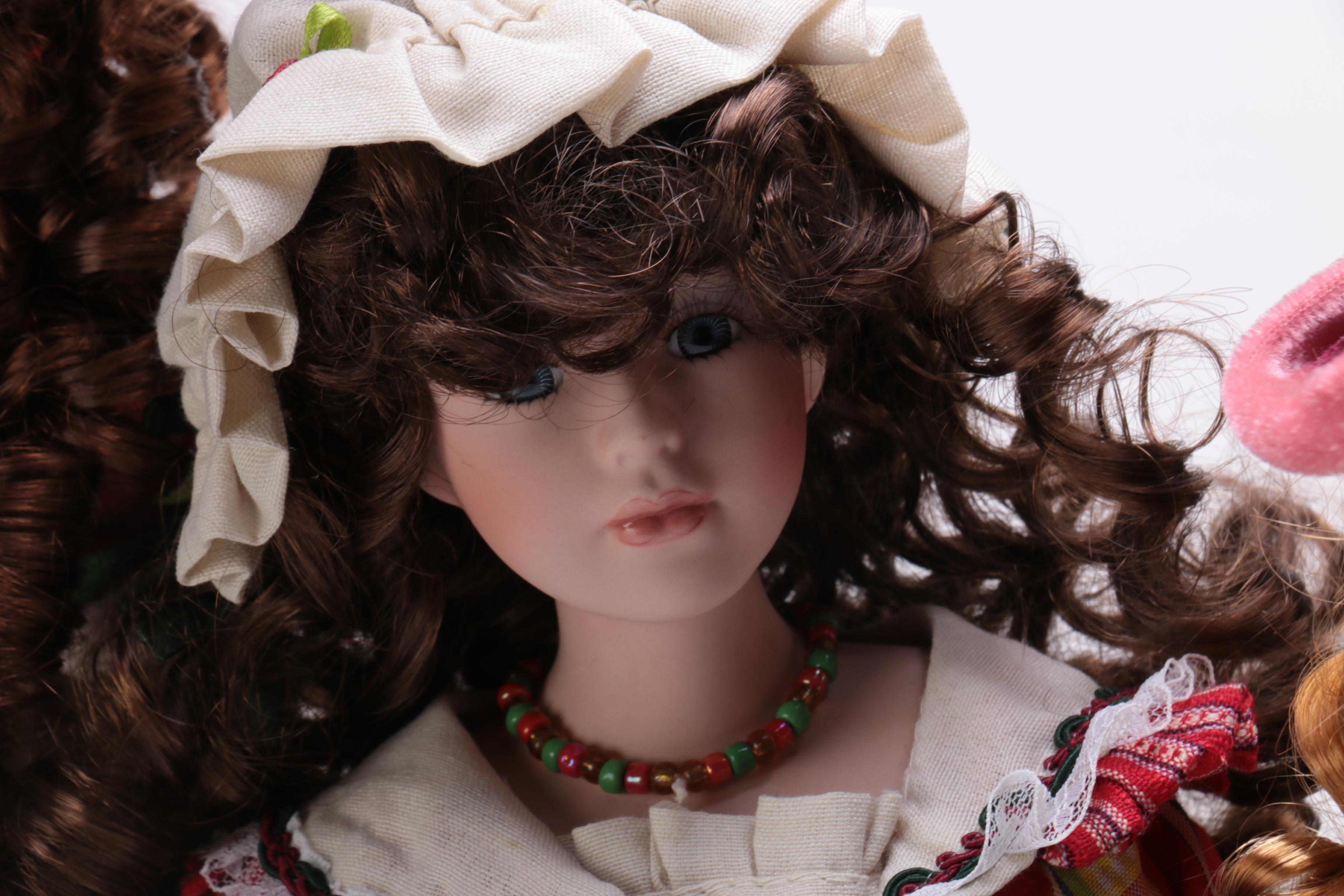 Collection of Four Porcelain Dolls