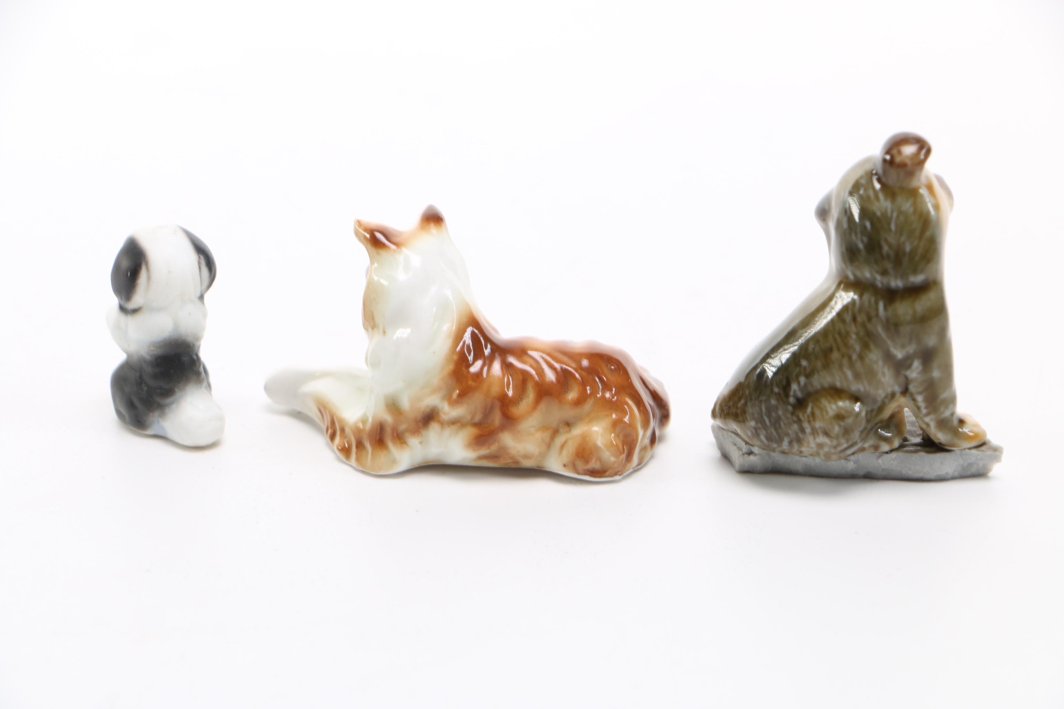 Assortment of Eight Vintage Ceramic Miniature Dog Figurines