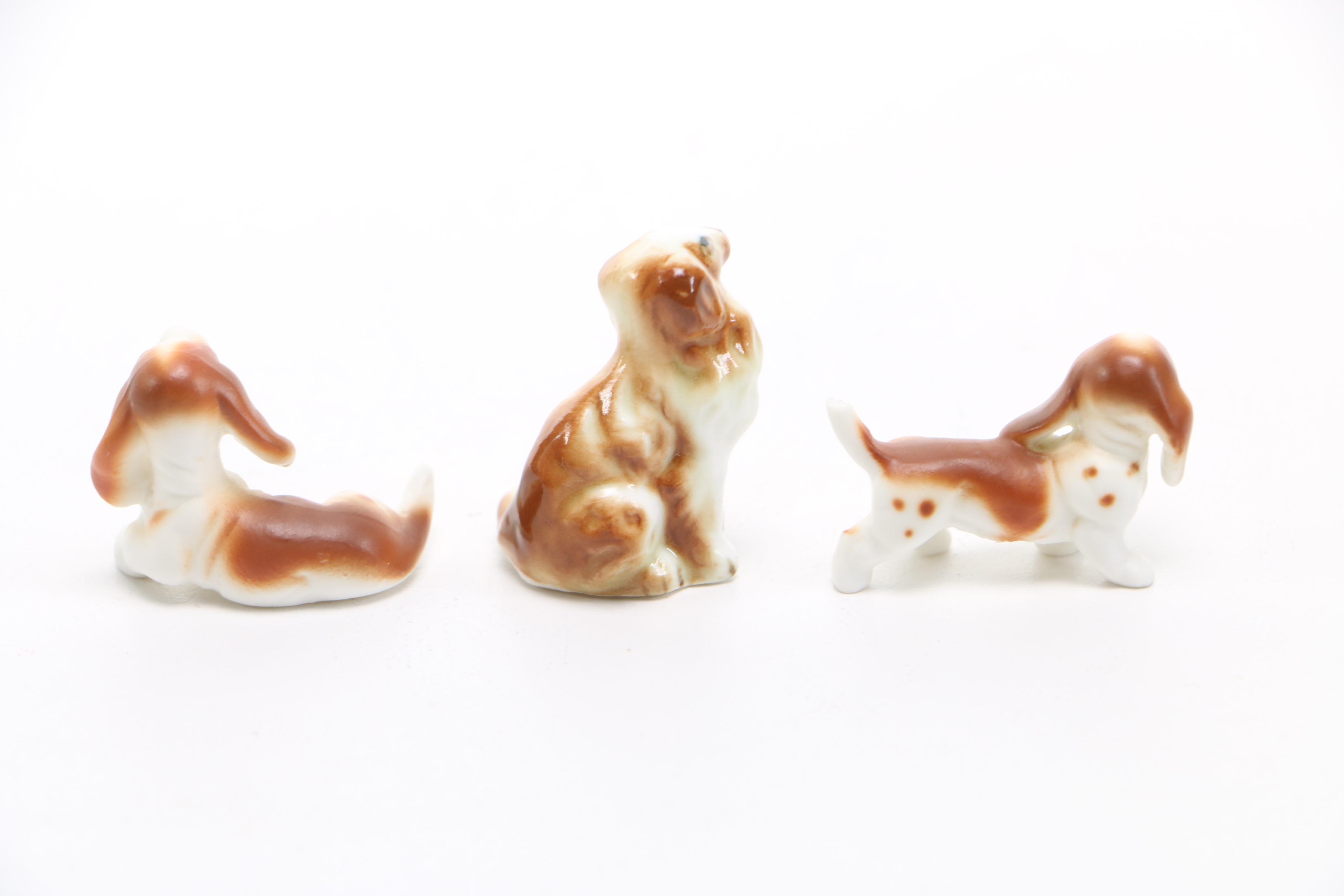 Assortment of Eight Vintage Ceramic Miniature Dog Figurines