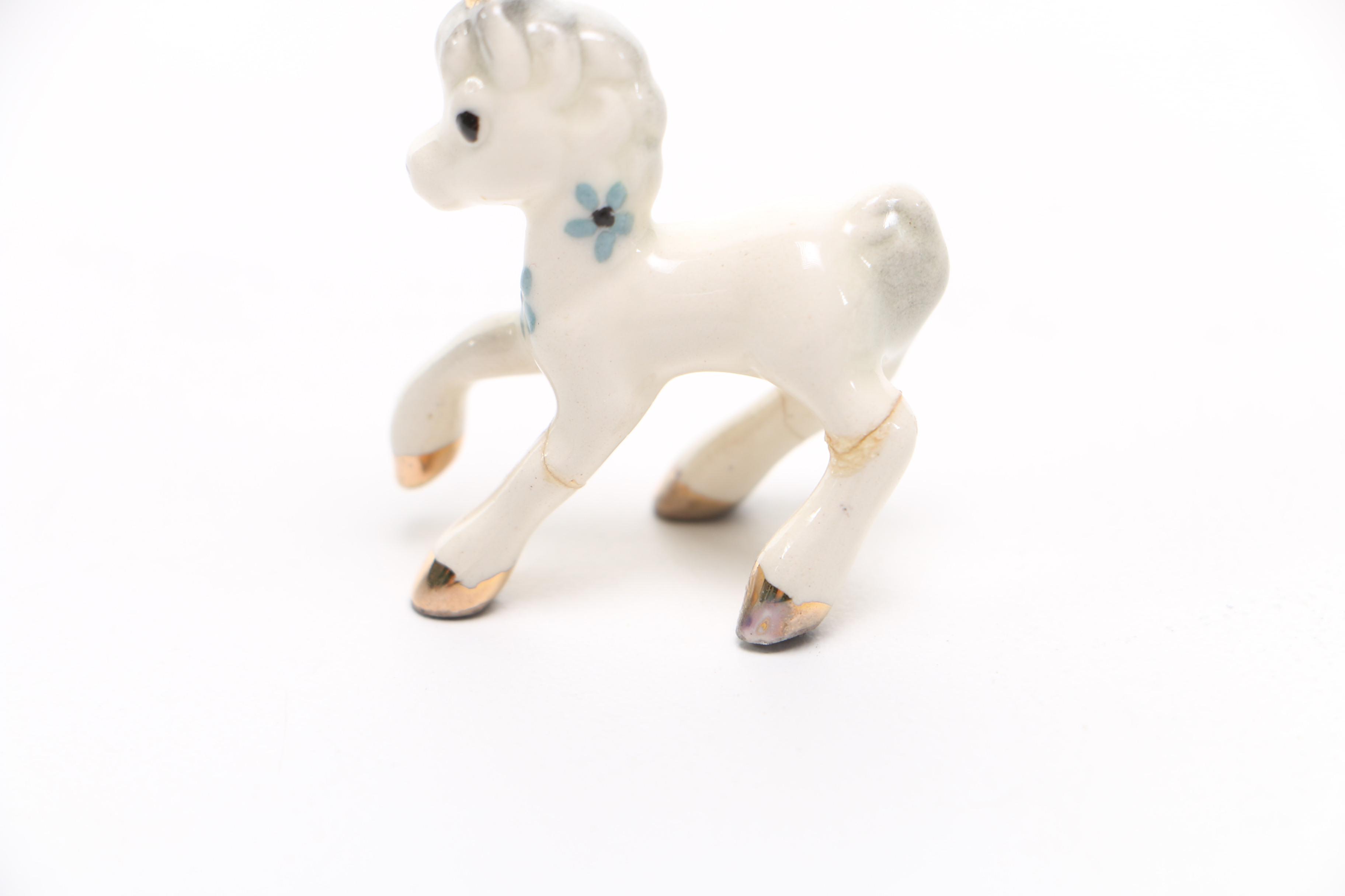 Assortment of Plastic and Ceramic Figures