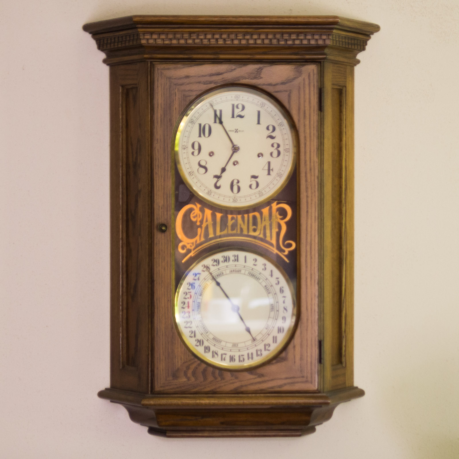 Howard Miller Calendar Wall Clock