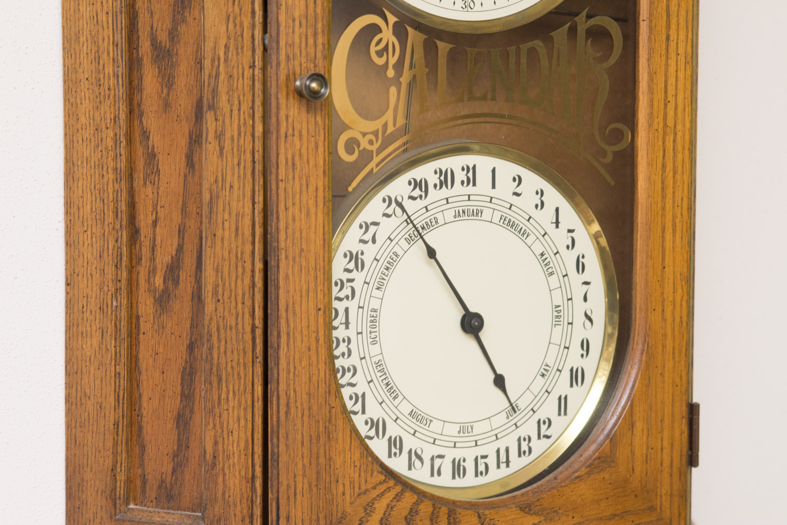 Howard Miller Calendar Wall Clock