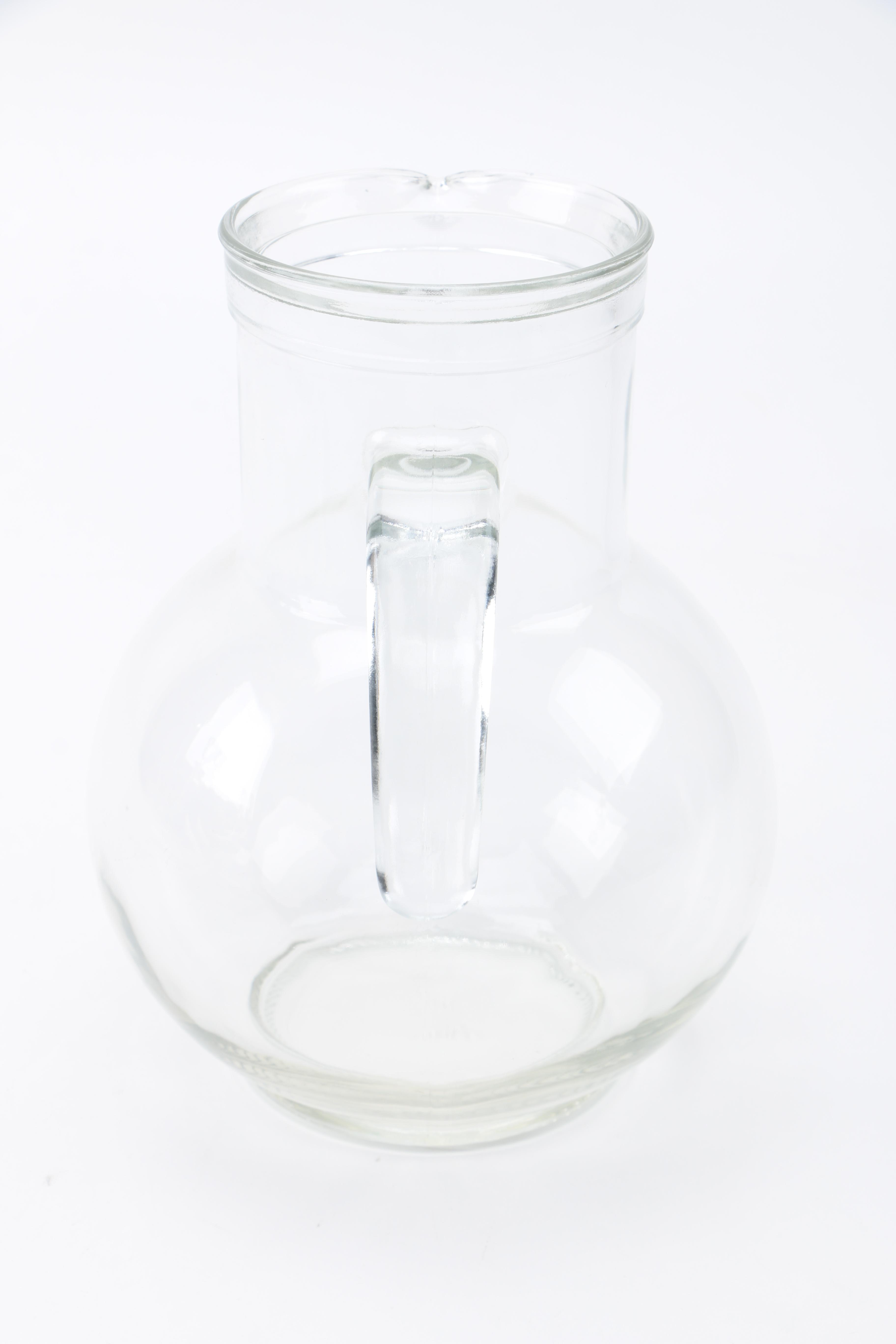 Two Clear Glass Decanters and a Pitcher