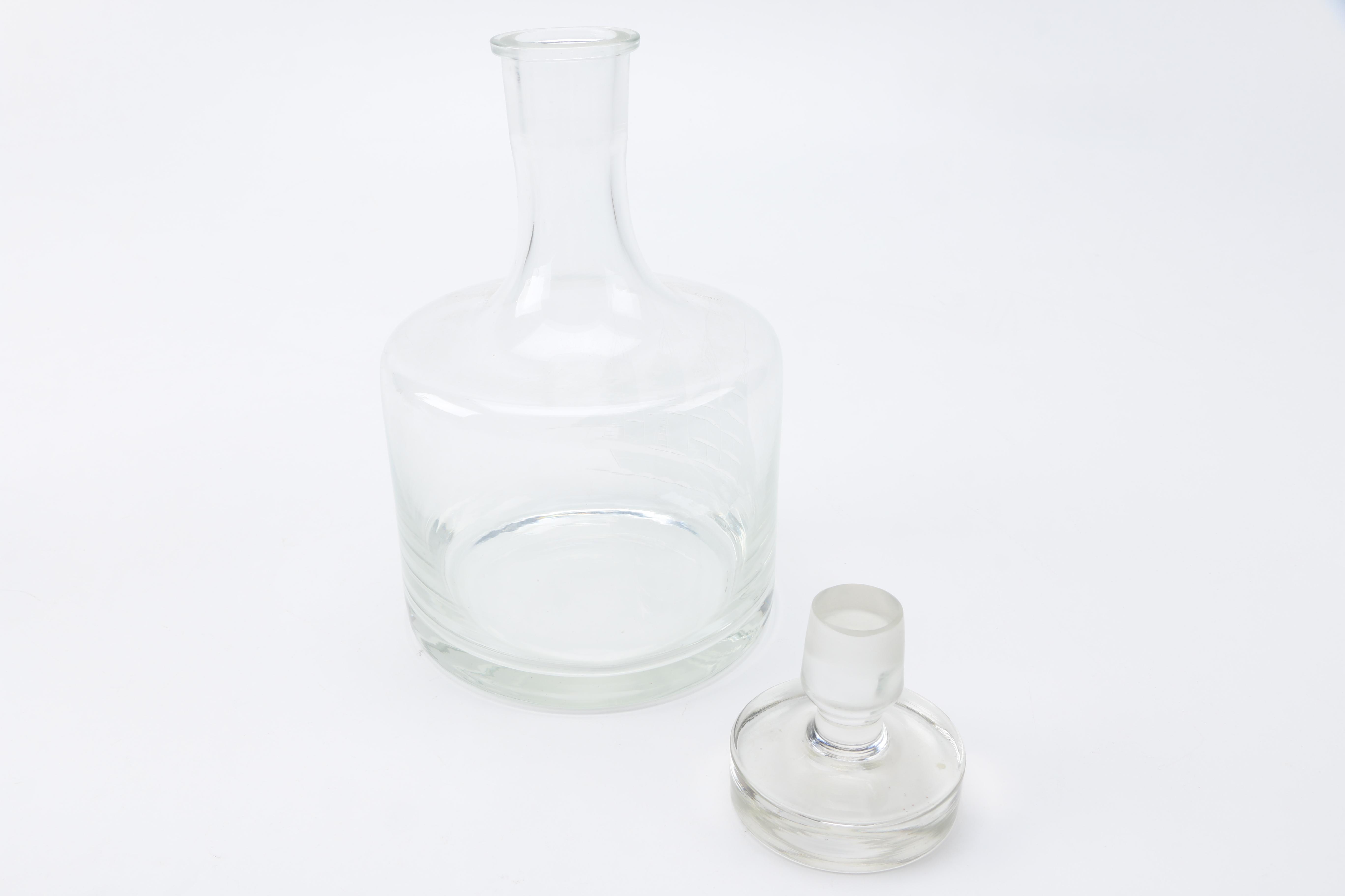 Two Clear Glass Decanters and a Pitcher