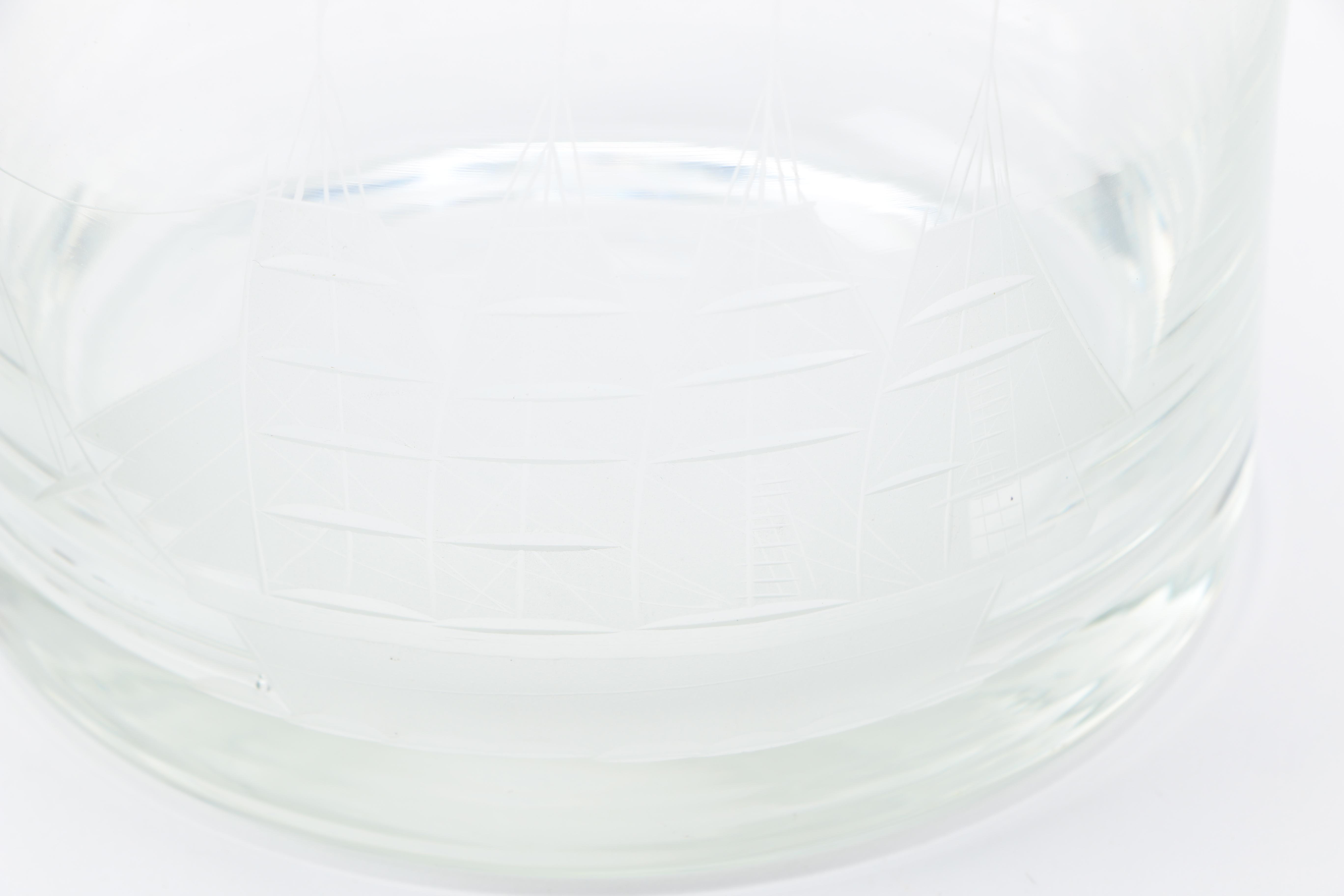 Two Clear Glass Decanters and a Pitcher