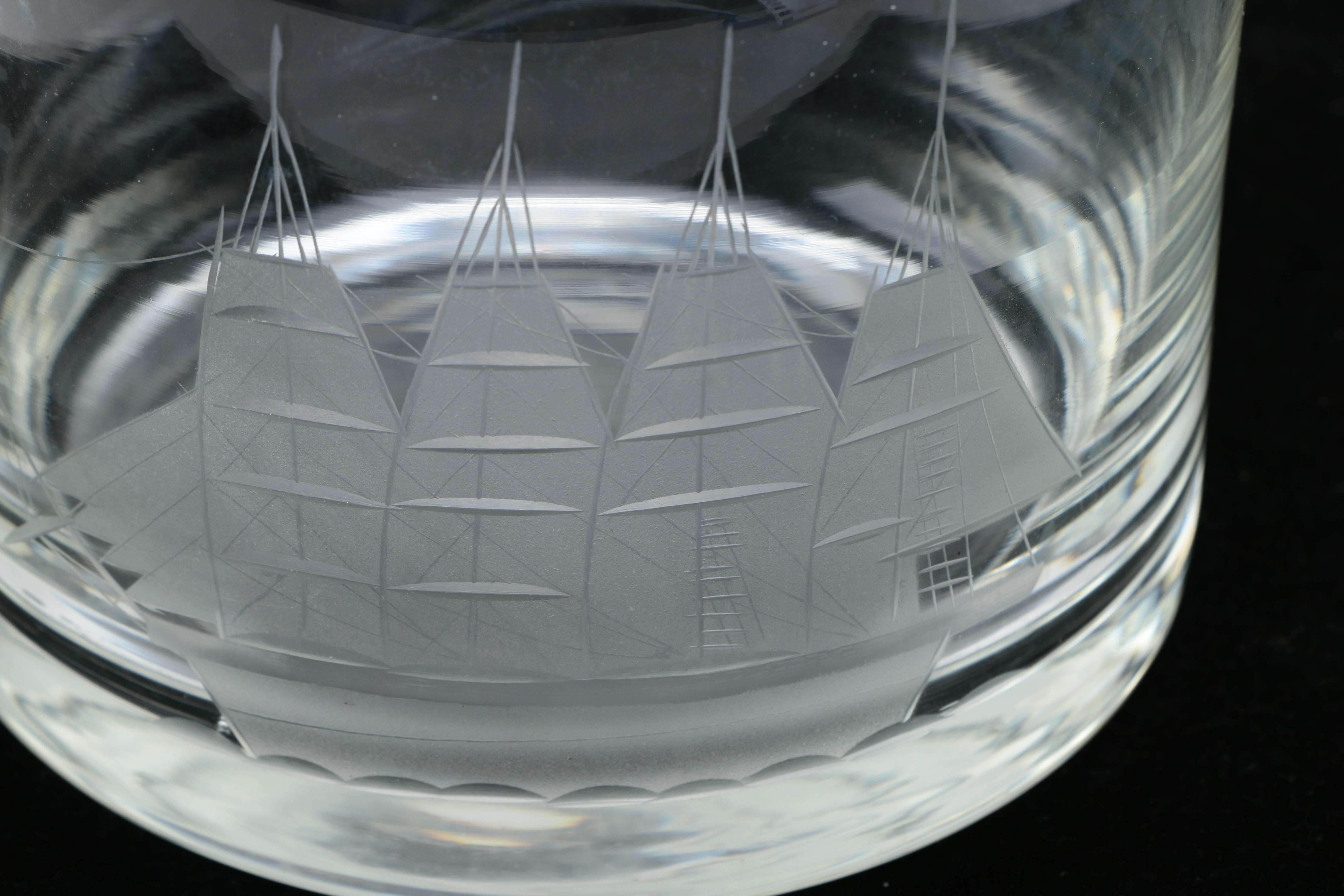 Two Clear Glass Decanters and a Pitcher