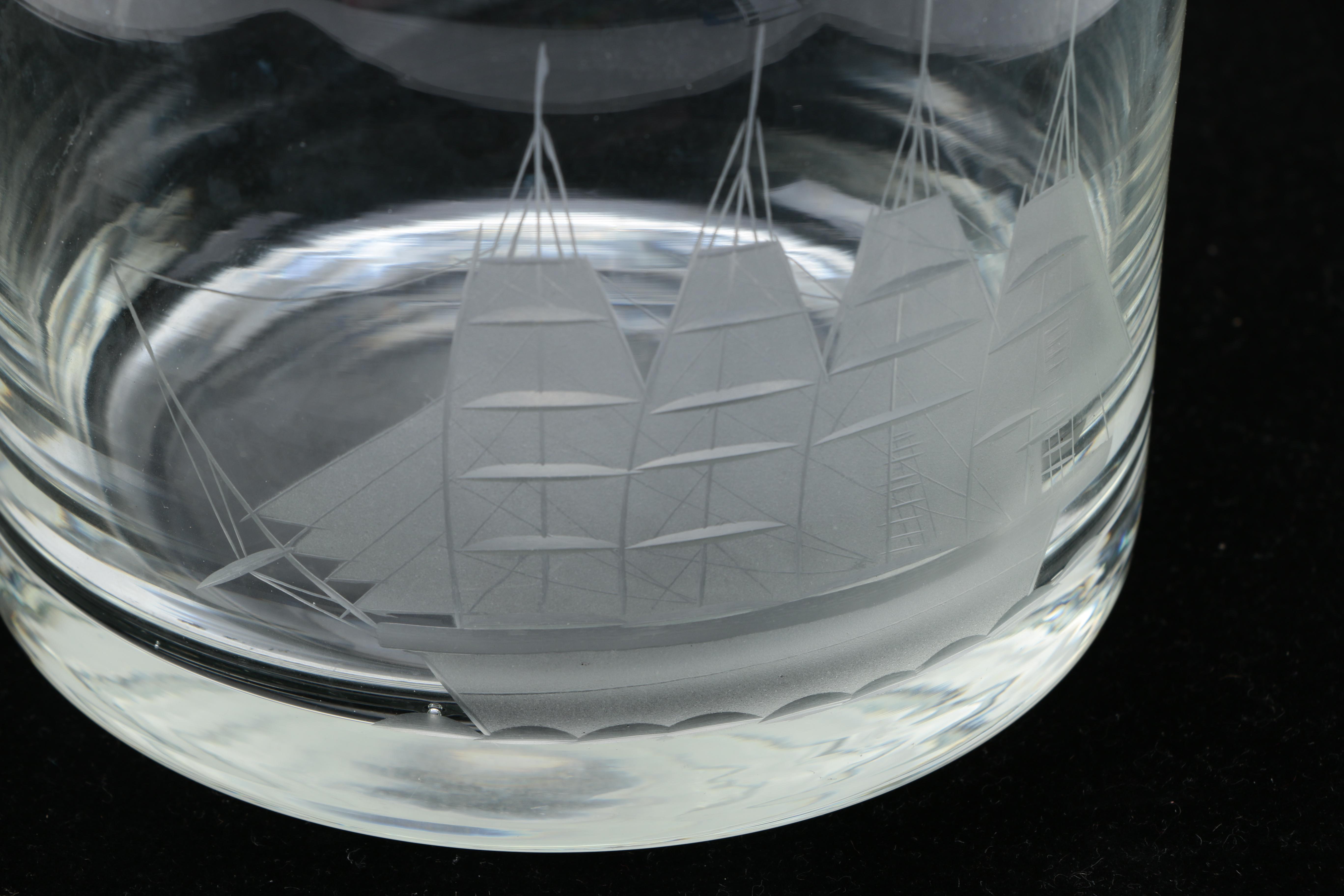 Two Clear Glass Decanters and a Pitcher