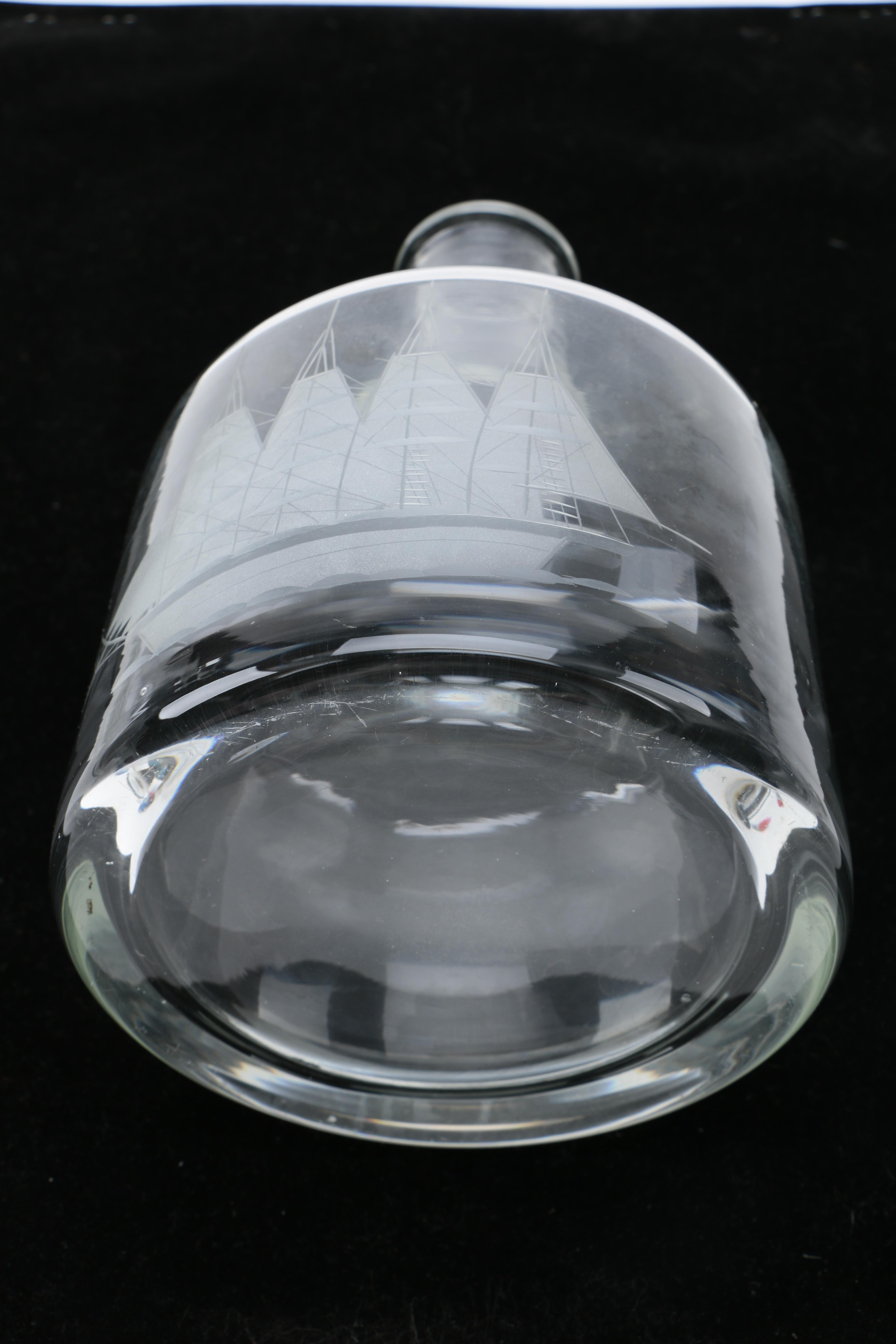 Two Clear Glass Decanters and a Pitcher