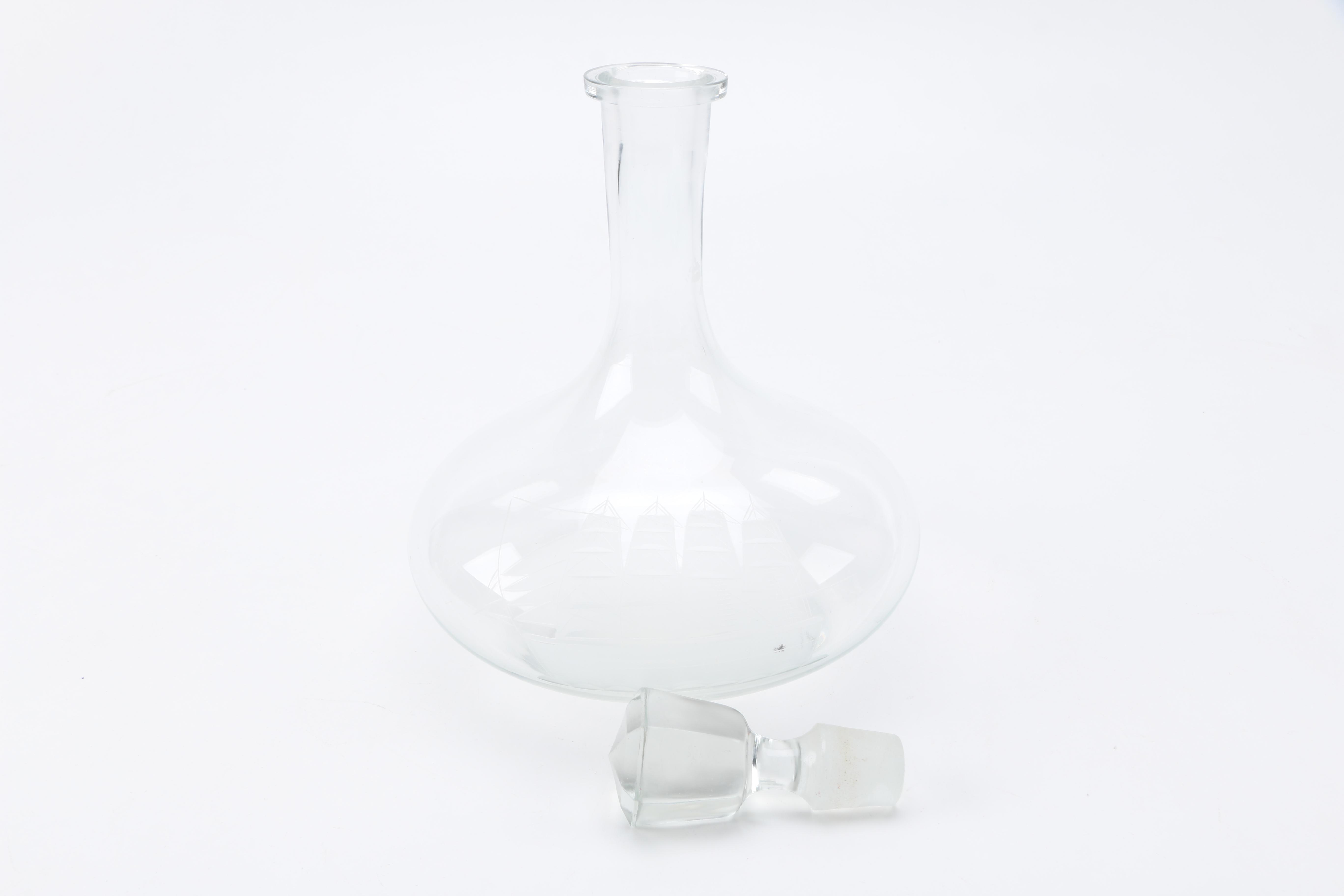Two Clear Glass Decanters and a Pitcher