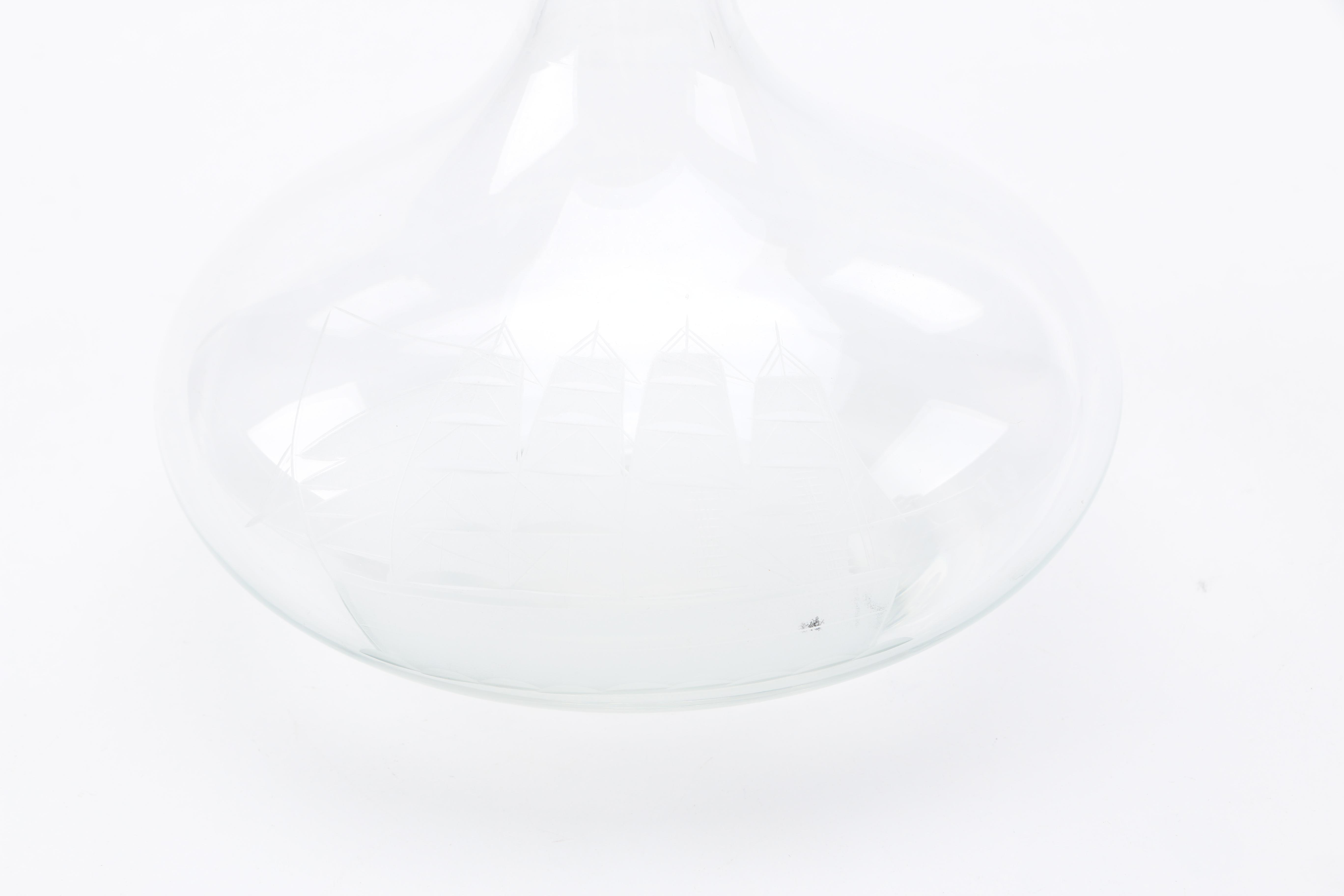 Two Clear Glass Decanters and a Pitcher