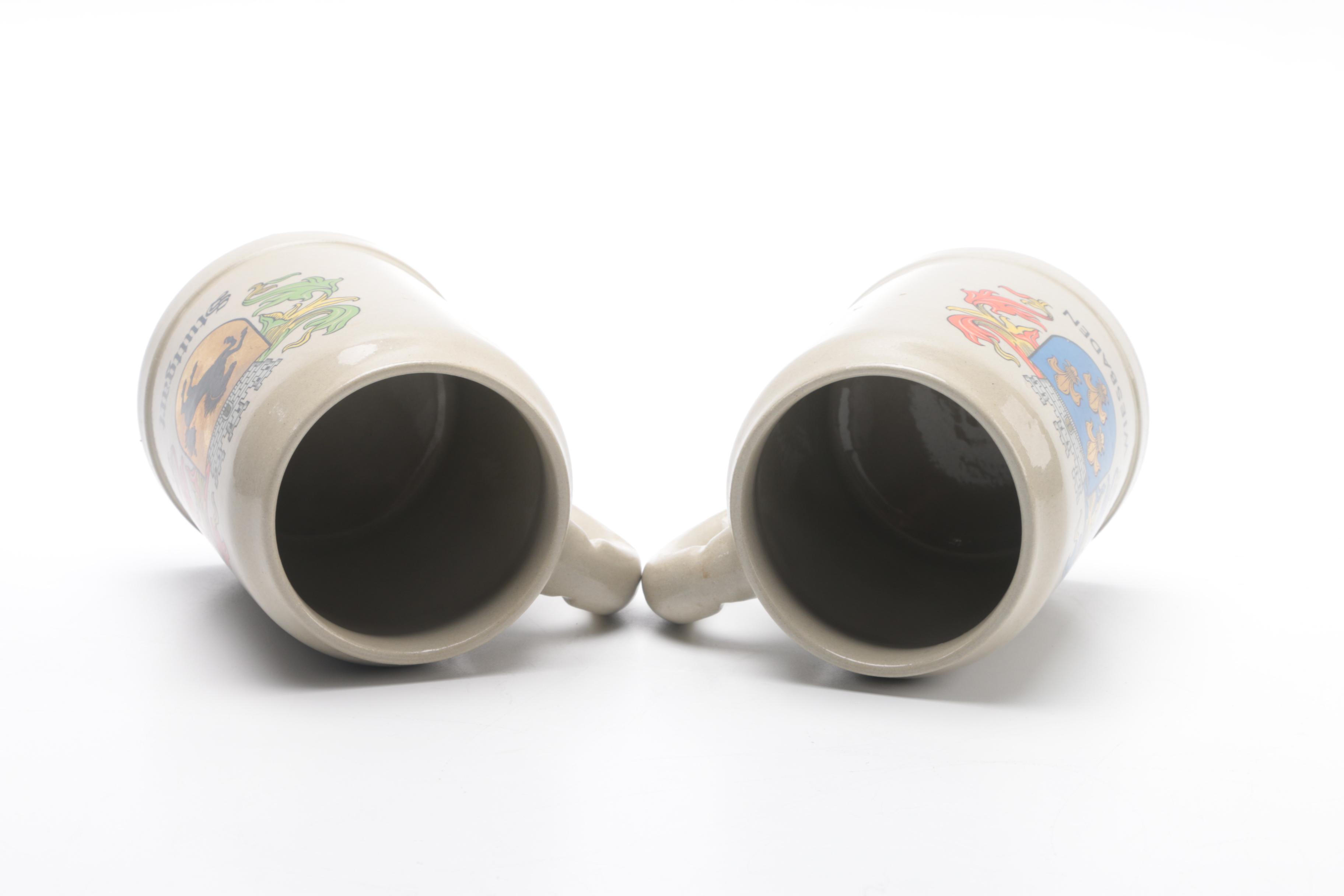 Four German Beer Steins With City Crests