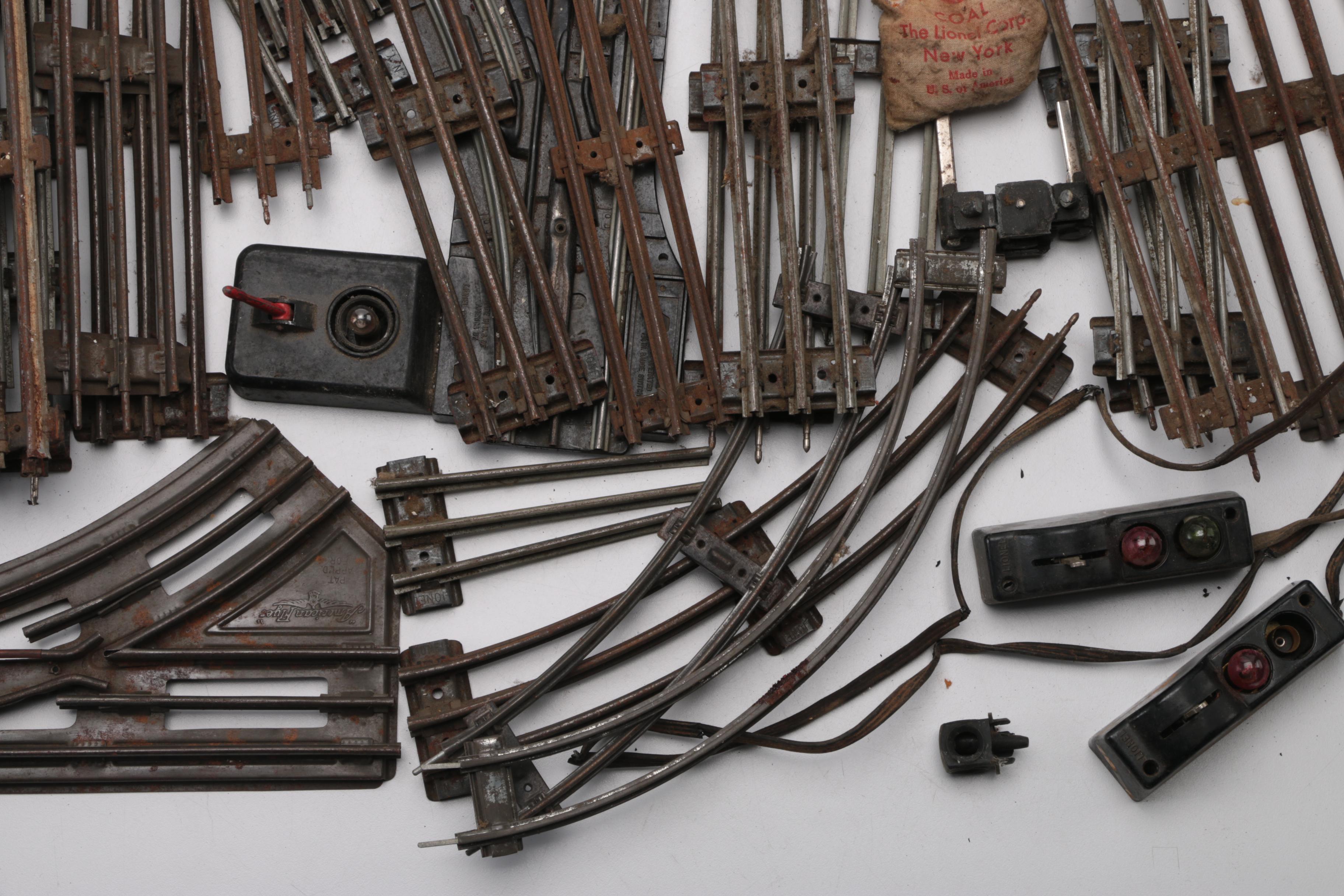 Collection of Train Tracks and Other Train Accessories